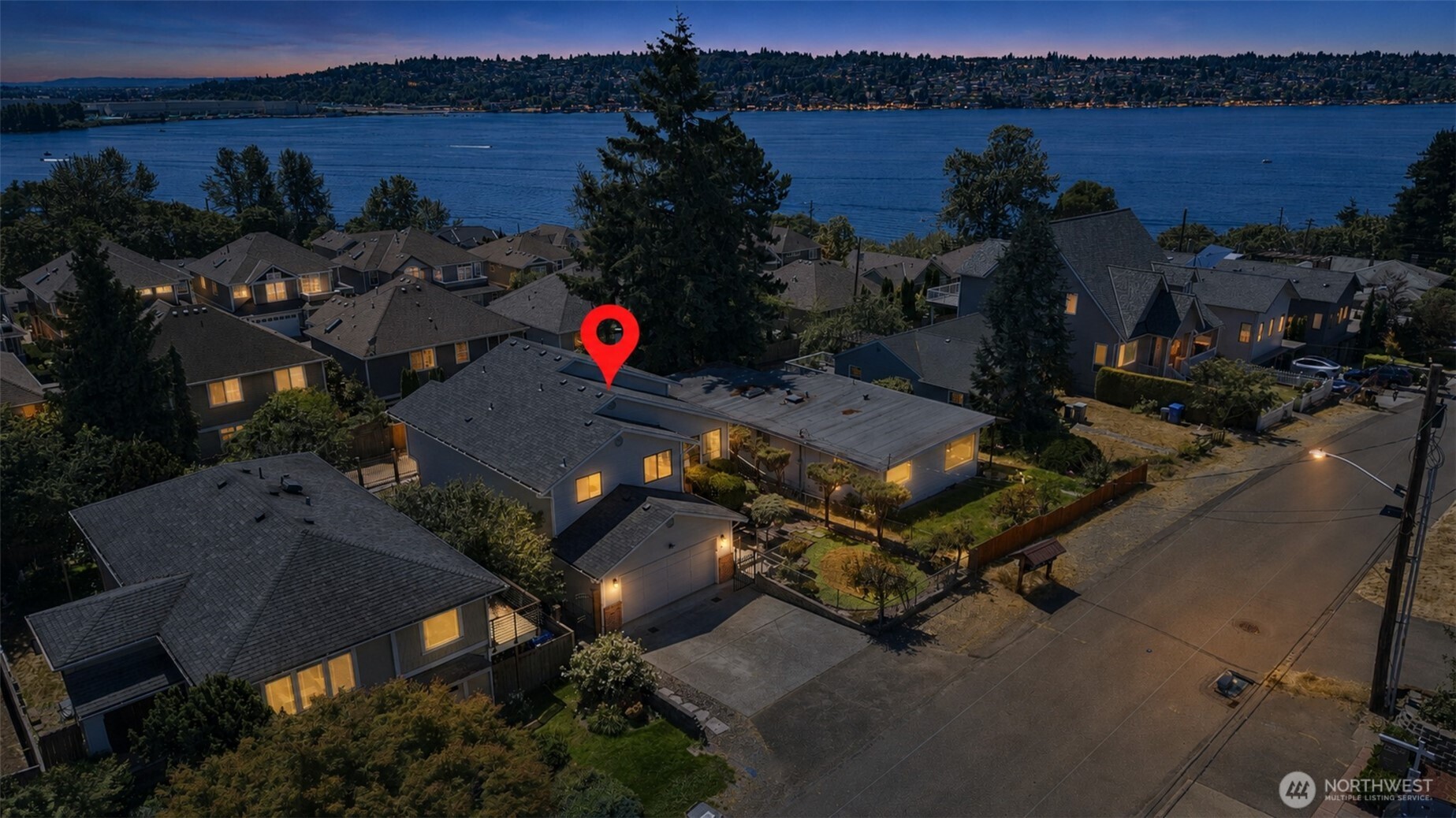 Beautiful Lower Kennydale home with views of Lake Washington! Offered for the first time in over 40 years, this 4-bedroom, 2.5-bath home offers 2,379 sq ft and an incredible opportunity to create your dream home in one of Renton’s most desirable neighborhoods. Major exterior improvements have already been completed, including a brand-new roof, gutters, exterior paint, new decking, fresh landscaping, and new siding on the south side of the home—providing a solid foundation for your vision. Inside, the updated downstairs bathroom is already complete, while the remaining interior offers the perfect opportunity to add your own style and build equity through cosmetic updates. Additional features include a newer water heater, attached 2-car garage, and convenient rear alley access with extra parking. Enjoy an exceptional Lower Kennydale location within walking distance of Gene Coulon Memorial Beach Park, Kennydale Beach Park, and the Seattle Seahawks practice facility. The Landing, downtown Renton, Boeing, I-405, Bellevue, and Seattle are also just minutes away, offering an ideal combination of recreation, convenience, and commuter access.