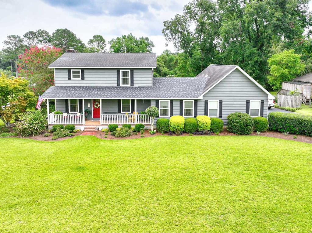 Welcome to 698 Fredonia Road, where timeless charm and comfortable living come together on a spacious lot of just over an acre. From the moment you step inside, you'll feel the warm, welcoming atmosphere that makes this house feel like home. It's a place where family memories have been made and new ones are waiting to be created. This 3-bedroom, 3-bathroom home also features a dedicated office, offering plenty of space for work, hobbies, or guests. Beautiful wood flooring flows throughout the home, with one section showcasing stunning heart pine floors that add warmth and character. The kitchen is designed for both everyday living and entertaining, featuring a butcher block center island with additional bar-top seating and prep space. High-end appliances, including a gas range, make this kitchen a dream for any home chef. Just off the kitchen is a cozy sitting area, creating the perfect space to stay connected with family and friends while meals are being prepared. The home also offers a spacious main living room with a beautiful brick fireplace that opens to the formal dining room, creating an inviting setting for gatherings and special occasions. A second living area provides even more flexibility for relaxing or entertaining. A large laundry room adds to the home's convenience and functionality. Step outside to enjoy the expansive screened-in porch overlooking a beautiful paver patio complete with a fire pit, making it the perfect place to relax or entertain year-round. The property also includes an additional storage building and a dog kennel, offering plenty of extra space for storage and pets. Located just minutes from downtown Thomasville, this property offers the peaceful feel of country living while remaining close to shopping, dining, schools, and everything Thomasville has to offer. Don't miss the opportunity to make this beautiful home your own. Call today to schedule your private tour.