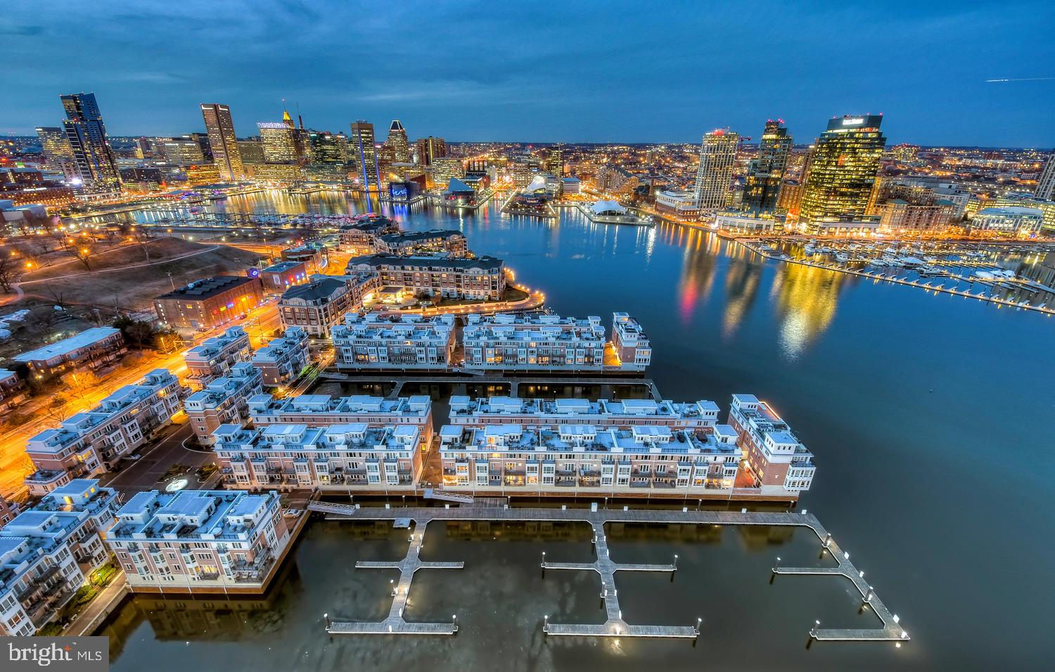 Discover an extraordinary end-of-group Pier Home offering the rare opportunity to live in a premier waterfront residence along Baltimore’s iconic Inner Harbor. Perfectly positioned within the prestigious gated community of The Pier Homes at HarborView, this five-level home captures breathtaking panoramic water and skyline views from every room. Designed for refined living and effortless entertaining, the home spans over 2,900 square feet and features three bedrooms plus a den, two full baths, one half bath, three verandas, a rooftop terrace, and a two-car garage with parking for up to four vehicles. The thoughtfully designed floor plan features 10-foot ceilings, oak hardwood floors throughout, and multiple indoor/outdoor living areas ideal for both entertaining and everyday comfort. The main level offers an expansive open-concept living and dining area with a gas fireplace, custom built-ins, powder room, and a chef’s kitchen appointed with gas cooking, stainless steel appliances, granite countertops, ample cabinetry, and a breakfast area. The third level presents a spacious primary suite complete with two custom walk-in closets, a balcony overlooking the harbor, and a spa-inspired bath with a soaking tub, double vanity, and glass-enclosed shower. The laundry room is conveniently located on the bedroom level, while the fourth floor offers two additional bedrooms, a full bath, and a flexible family room or home office with stunning water views. Recent upgrades further elevate this home’s appeal, including an epoxied two-car garage floor, new 75-gallon hot water heater and 4-gallon expansion tank, updated lighting, new window treatments throughout, new washer and dryer, custom built-in closets and laundry room, outdoor rooftop TV with waterproof casing, and integrated smart home features. Enjoy unparalleled harbor views from every level, whether relaxing by the fireplace, dining al fresco on the veranda, or entertaining on the private rooftop terrace. The Pier Homes at Harborview deliver the ultimate balance of luxury, waterfront serenity, and downtown convenience. Community amenities include 24/7 security, attended gate entry, concierge, fitness center, outdoor pool access, marina, private trash and snow removal, and beautifully landscaped grounds all just steps from the Inner Harbor Promenade, Federal Hill Park, top restaurants, shopping, and easy access to I-95.