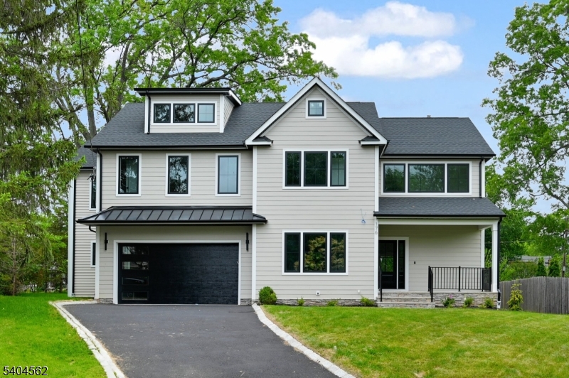 This stunning NEW CONSTRUCTION Colonial offers over 4,600 square feet of luxurious living space across four levels, featuring six spacious bedrooms and five full and two half bathrooms on a serene 0.2-acre lot, situated on a quiet CUL-DE-SAC street. As you approach the property, a welcoming front porch invites you inside. The open-concept floor plan seamlessly connects the formal dining room to a chef's kitchen, complete with custom cabinetry, high-end appliances, a center island, and a walk-in pantry. Beautiful hardwood floors and exquisite custom trim work enhance the home's sophisticated aesthetic. The family room boasts an electric fireplace and sliding doors that lead to a deck and patio, overlooking a flat backyard ideal for outdoor entertaining.The first floor features an ensuite bedroom with a walk-in closet and a convenient powder room. Upstairs, you'll find four additional bedrooms and three bathrooms, including a primary suite with dual walk-in closets and a spa-like bath featuring dual sinks and a glass shower. A laundry room adds practicality to this level. The finished attic space provides flexible use options with its half bath and recreation room, while the finished basement includes another rec room, an office, and a full bath. Located just minutes from downtown Westfield and the Garden State Parkway, this home is perfectly situated for easy access to town and trains. Comes with10 Years Builders warranty.