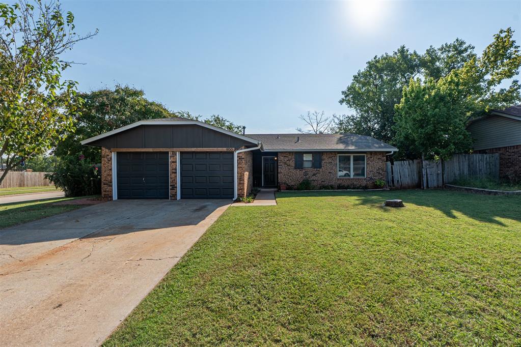 Oh hello! Attention First Time Home Owners, Downsizers, Budget Correctors, Two Sisters Sharing HomeOWNership .... Welcome to your happy place! Sitting pretty on a corner lot with mature shade trees, this home not only backs up to Veterans Park but also puts walking trails, a playground, and even an entertainment pavilion right in your backyard. 
Step inside and you’ll love the light, bright, open and airy feel—easy-care laminate floors, ceiling fans in most rooms, and a dining room filled with sunshine through a picture-perfect window overlooking the yard. The galley kitchen shines with stainless steel appliances, a roomy single-bowl sink, and fresh satin brass hardware for just the right touch of elegance and style. 
Updated bathrooms keep things fresh, while the private en suite bath in the spacious primary bedroom adds everyday convenience during the frenzy of rush hour. Storage is plentiful, and the garage can be anything you need—parking, storage, or even a home gym. With the back patio being on the east side of the home, it's an oasis for all seasons. From cozy Autumn evenings by a firepit to Springtime pickleball in the lush grass. You'll be amazed how you will use this space.  
From the front patio to the shaded backyard, this home is all about comfort, connection, and fun living. Move-right-in ready, no work needed, can close quickly. Close proximity to the University of Oklahoma, to Tinker Air Force Base and downtown Oklahoma City. Hurry, this cutie won't last long before finding her forever People.
