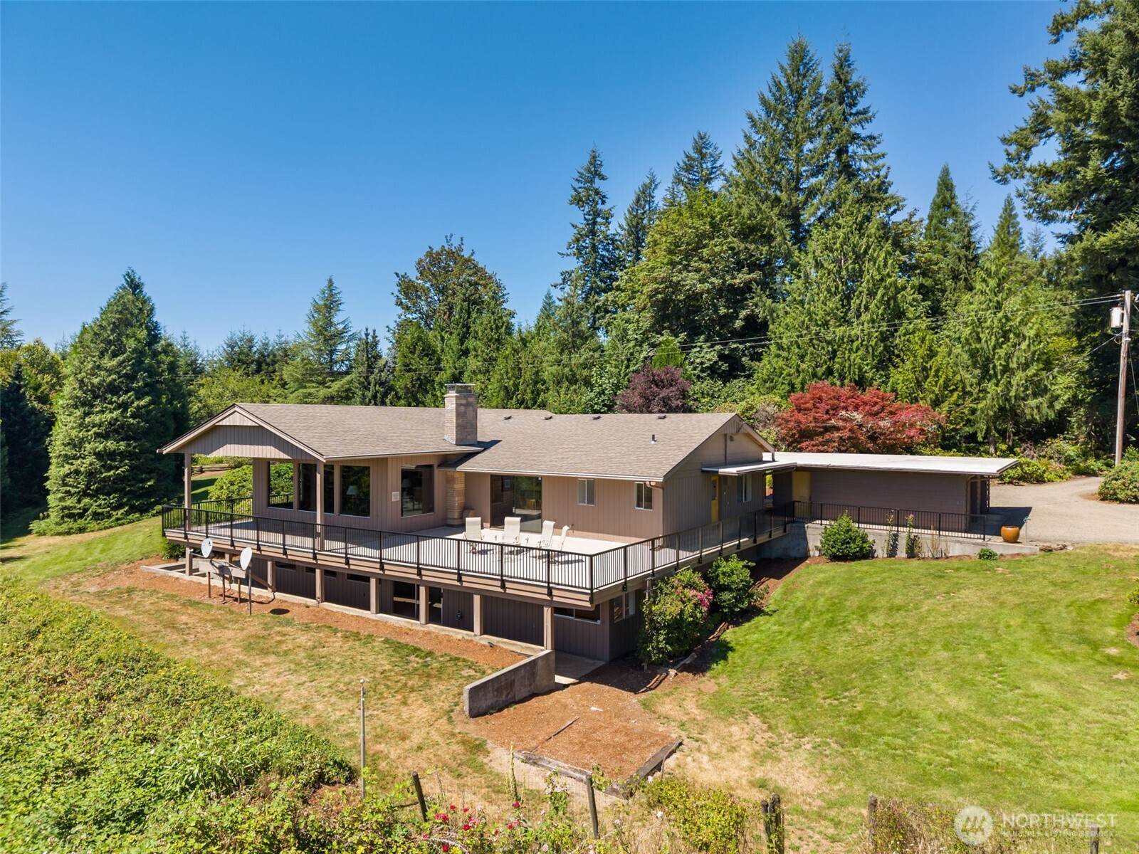 Come experience this fantastic custom home located on a 20 acre hideaway with an extraordinary view oriented to the South which includes Lake Mayfield, Mt St Helens & miles And miles of horizon. This Mid Century Modern has over 3,000 square feet on the main level. Slate entry leads you to great room with attractive wood paneling, soaring tongue and groove ceiling with huge open beams, floor to ceiling stone fireplace and, of course, that epic view. Many unique features include office area off master, large craft/sewing area with loads of storage and dumb waiter to bring up fire wood. Updated kitchen has quartz counter, custom cabinet, tile backsplash, ample lighting and hardwood floors. Large utility/pantry room located just steps from the kitchen. Three bedrooms and 2.5 bathrooms upstairs. Downstairs is a 2,200 square foot basement has one bedroom and a 3/4 bath. Very large room, with the view, has been used as the family rec room for decades. Outside, the expansive deck is part covered and part open with new floor treatment and new powder coated aluminum railing. Garage side of the home also has a patio which is part covered and part open, great for barbecuing. For all your toys and farm accessories there is a 64 ft x 32 ft (2048 ft) shop with enclosed space for Tractors RVs, boats & ATVs etc along with a 32ft x 16ft (512ft) attached lean-to. RV parking with electrical & water hookup for traveling guests with RVs. Your acreage to the East offers another super view.