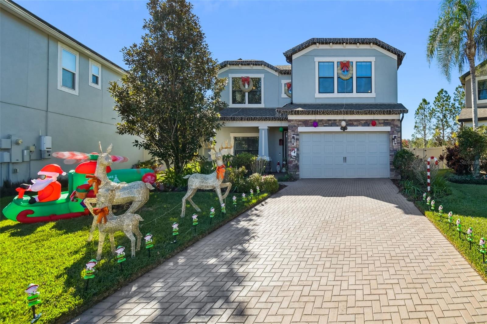 Located in the highly sought-after Long Lake Ranch community, this exceptional home showcases extensive upgrades and refined architectural details throughout. Offering 3,316 square feet of open living space, the home features 5 bedrooms, 3 full bathrooms, and a spacious second-floor loft/game room. The roof is less than one year old, with a fully owned $28,000 solar power system to keep energy costs incredibly low—averaging just $30–$40 per month.The gourmet kitchen is a true showstopper, featuring upgraded cabinetry with large drawers, granite countertops, a large single-basin custom granite sink, center island, walk-in pantry, butler’s pantry, double wall ovens, and high-end stainless steel appliances. The kitchen opens seamlessly to the family room and breakfast nook, creating the perfect space for entertaining. Much of the downstairs living area is enhanced by a beautiful upgraded plank ceiling. A stunning wooden staircase leads to the expansive second-floor loft, offering flexible space ideal for a media room, home office, or play area. The spacious primary suite features two walk-in closets and a luxurious en-suite bath with soaking tub, dual sinks, and a walk-in shower. Three additional bedrooms are also located upstairs.Additional highlights include a downstairs bedroom with adjacent full bath, crown molding, upgraded lighting, ceiling fans in every room, a large utility room, extended under-stair storage, gutters surrounding the entire home, and a whole-house water softener with carbon filtration.Sliding glass doors lead to a covered patio and extended rear concrete slab, overlooking a large fenced, pie-shaped backyard with mature landscaping—perfect for outdoor entertaining. The gazebo is included with the home!Long Lake Ranch offers resort-style amenities including two community pools, tennis and basketball courts, playgrounds, a dog park, clubhouse, scenic walking trails, and a 50-acre lake with dock (no motorized boats). This home perfectly blends luxury, efficiency, and lifestyle in one of the area’s most desirable communities. Schedule your showing today—this one won’t last!