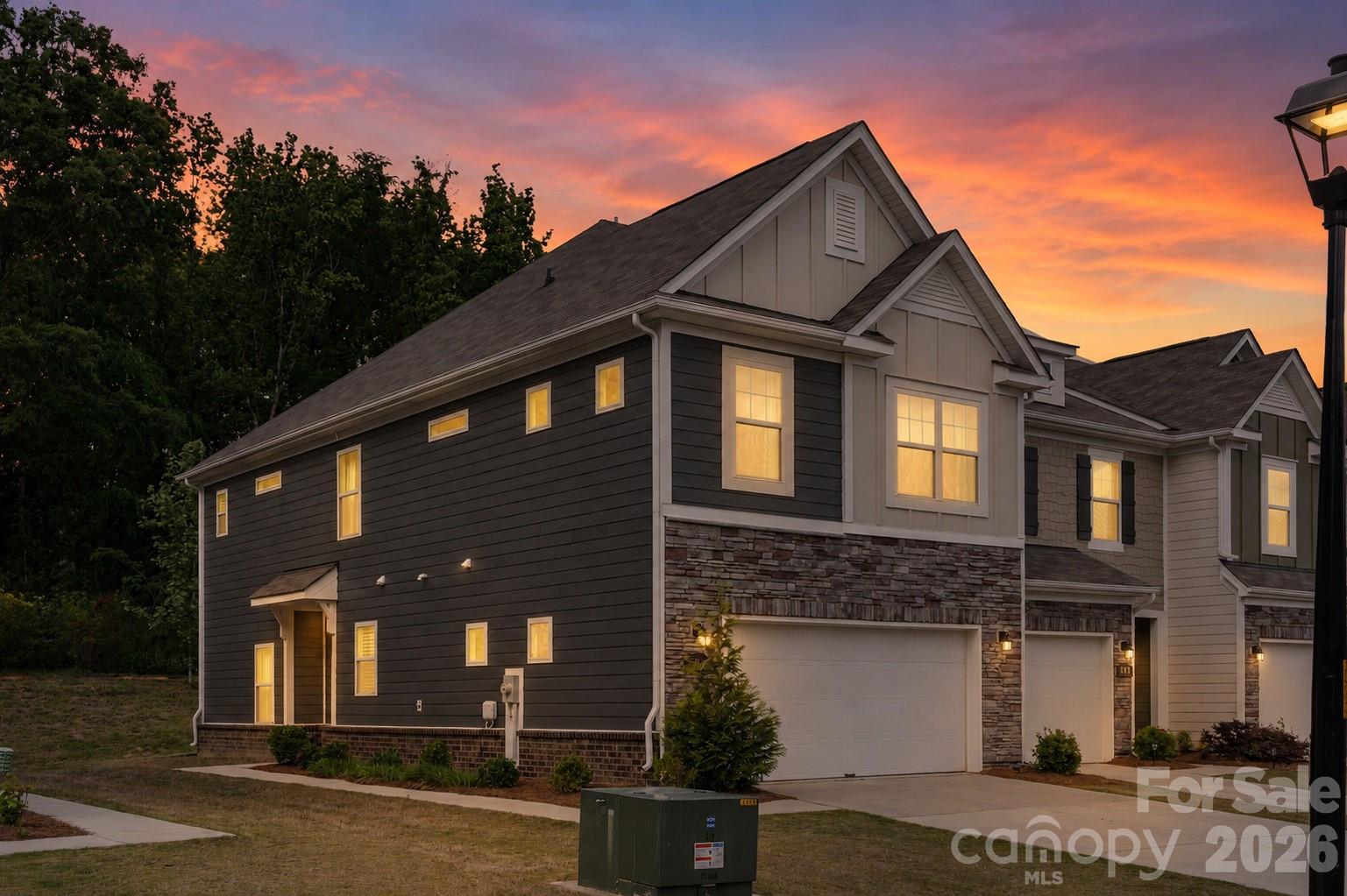 Come experience 230 Quinn Rd in the desirable Harpers Run community—where location and lifestyle come together. Ideally situated just five minutes from charming downtown Matthews, with quick access to I-485 and the Hwy 74 bypass, this home offers an easy commute while enjoying the benefits of Union County living, including lower taxes and access to highly regarded Sun Valley schools.This spacious townhome is currently the ONLY end-unit property available in Harper's Run, and is highly coveted with a two-car side-by-side garage, a large side yard and in a premium community location with private woods behind and on a cul-de-sac with minimal traffic. Inside, you’ll find thoughtfully curated designer upgrades throughout. A striking upgraded front door sets the tone, leading into a stylish interior featuring elevated kitchen finishes, modern lighting, custom window drapes, and on-trend feature walls that add character and warmth. The spacious primary suite boasts a large walk-in closet with custom built-ins, and one of the two secondary bedroom has also been enhanced with custom closet solutions.Move-in ready and meticulously maintained, this home blends function with style in all the right ways. As an added incentive, the sellers are offering to prepay a full year of HOA dues with an acceptable offer—creating even more value for the next owner. Don’t miss this opportunity to own in one of the area’s most convenient and connected locations.