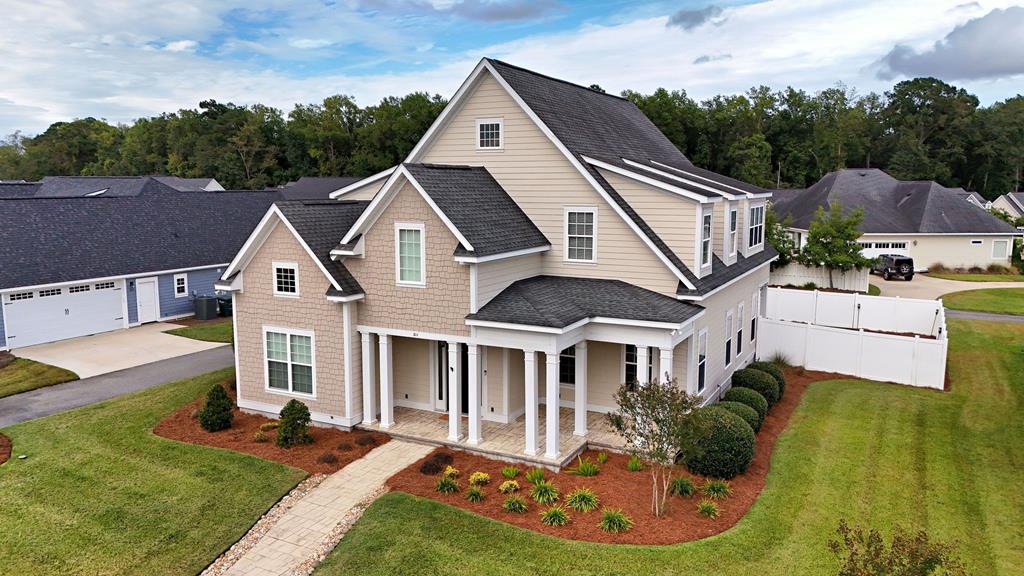 This isn't your average build. With standout style & a location that nails convenience & community. This 5 bedroom/4 bath home located in prestigious Madison Grove Subdivision brings modern comfort in Thomasville, Ga together in all the right ways. Beautiful exterior, lush landscaping, and a front porch made for ice cold drinks and neighborly chats.  Inside, it's clean, open, and designed to live well -- think flowing main floor, with primary suite along with another bedroom & bath. Upstairs, another spacious bedroom with dedicated office space, 2 more bedrooms and bath, along with a flex game room gives you room to spread out or come together.  Dream kitchen, hard surface countertops, pot filler, island and stainless steel appliances as well as a extra large pantry. Design details shine throughout: hardwood floors, designer lighting, high ceilings and a fireplace. French doors lead to a very entertaining back porch and fenced yard giving you even more space to relax and entertain.  Alley access oversized 3 car garage and practical mud room/laundry makes everyday living easy and organized.  Additional insulation with 2 upgraded high efficiency AC units & a smart thermostat that you can program from your phone. Pool, gym & clubhouse is available to residents. Ready to tour a home that stands out in all the best ways? Schedule your tour today!