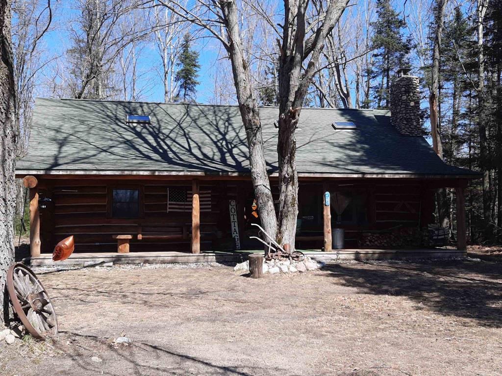 Here is the beautiful 1,670 sq ft log home and 40 acres you have been dreaming of! Complete with private pond...all surrounded by state land on 3 sides! This log home has all the amenities and is spaciously laid out with cathedral ceilings and a great loft area!  Just in time for summers fun, you will love your own completely secluded recreational property. You will be amazed that you can own this very private estate and still be within a short drive to Houghton Lake, Saint Helen, West Branch and I-75. This opportunity is ready for you to use year around or for those great private family vacation getaways. Easy access to LOTS of ATV and Snowmobile trails. This property has all the wildlife viewing and sporting opportunities ready for you. There is a combination of high ground hardwoods and alder marshes that the deer, turkey, grouse, bear etc love to call home. You will appreciate the recent updates: new furnace (2025), beautiful kidney shaped pond complete with aerator sprinklers for winter oxygen for the fish, new flooring (2022), and the rear deck and electrical service has been added for the hot tub. Your toys will appreciate the 24 x 40 pole building garage and work shop area and additional storage shed. This property has it all...ready for you to enjoy...the appliances, home furnishings, hot tub, 2 hunting blinds, 2 ladder stands and a 12 month home warranty are all being made available to you from the sellers.  Don't miss out on this truly remarkable opportunity.