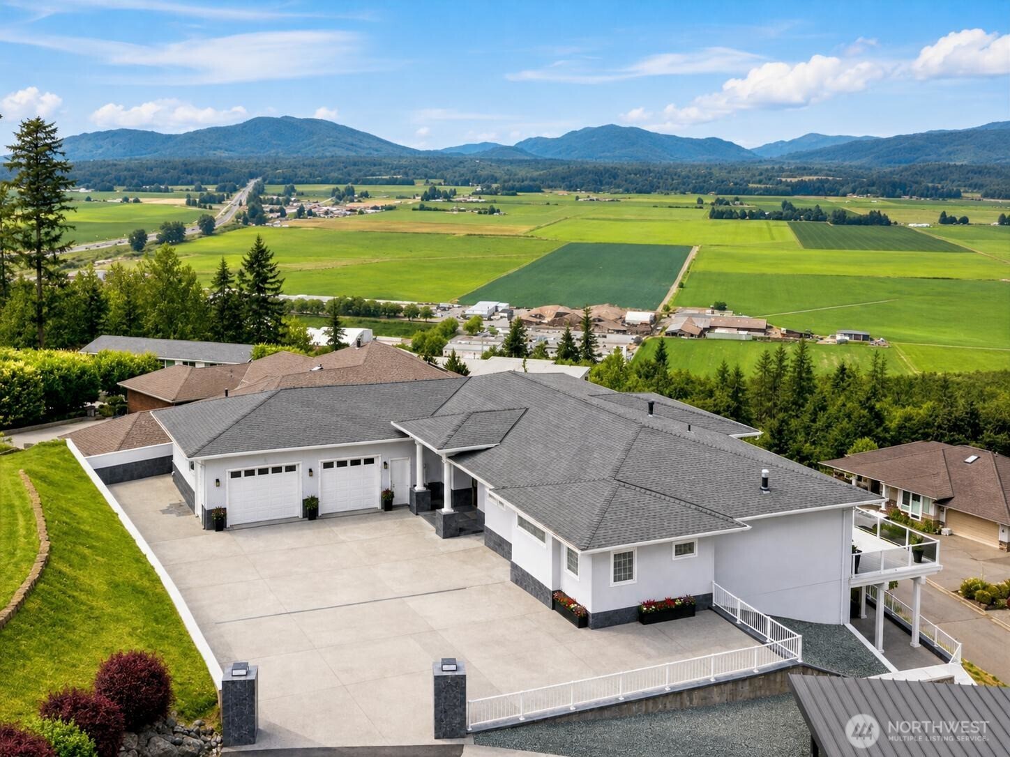 Top-of-the-world views! This spectacular setting overlooks the lush green Skagit Valley, Cascade Mountains, the Sound, San Juan Islands, and everything in between! An exceptional private retreat feeling. Arguably one of the finest homes built in Skagit County! Solid ICF concrete construction pairs with superior interior finishes and premium lighting throughout including fiber-optic lighting in the living room and primary suite ceiling coves. The stunning primary suite also features an oversized walk-in shower, jetted tub with color-select lighting, TV and heated floors. Outstanding views unfold from every level. Additional highlights include an integrated sound system, heated floors in three baths, three bedrooms with en-suite baths. The expansive deck features overhead radiant heaters, sound system and ready for an extra capacity hot tub. The lower level offers a generous game room, theater, gym, two bedrooms, bar and an entertainment-sized view patio. Prewired security with cameras and dual heat pumps. The finished garage has heating and air conditioning, along with 50-amp garage service, 30-amp RV service and exhaust fans. Conveniently located between, Bellingham and Everett, near Anacortes. One hour north of Seattle. Just minutes to I-5, shopping, dining and coffee.