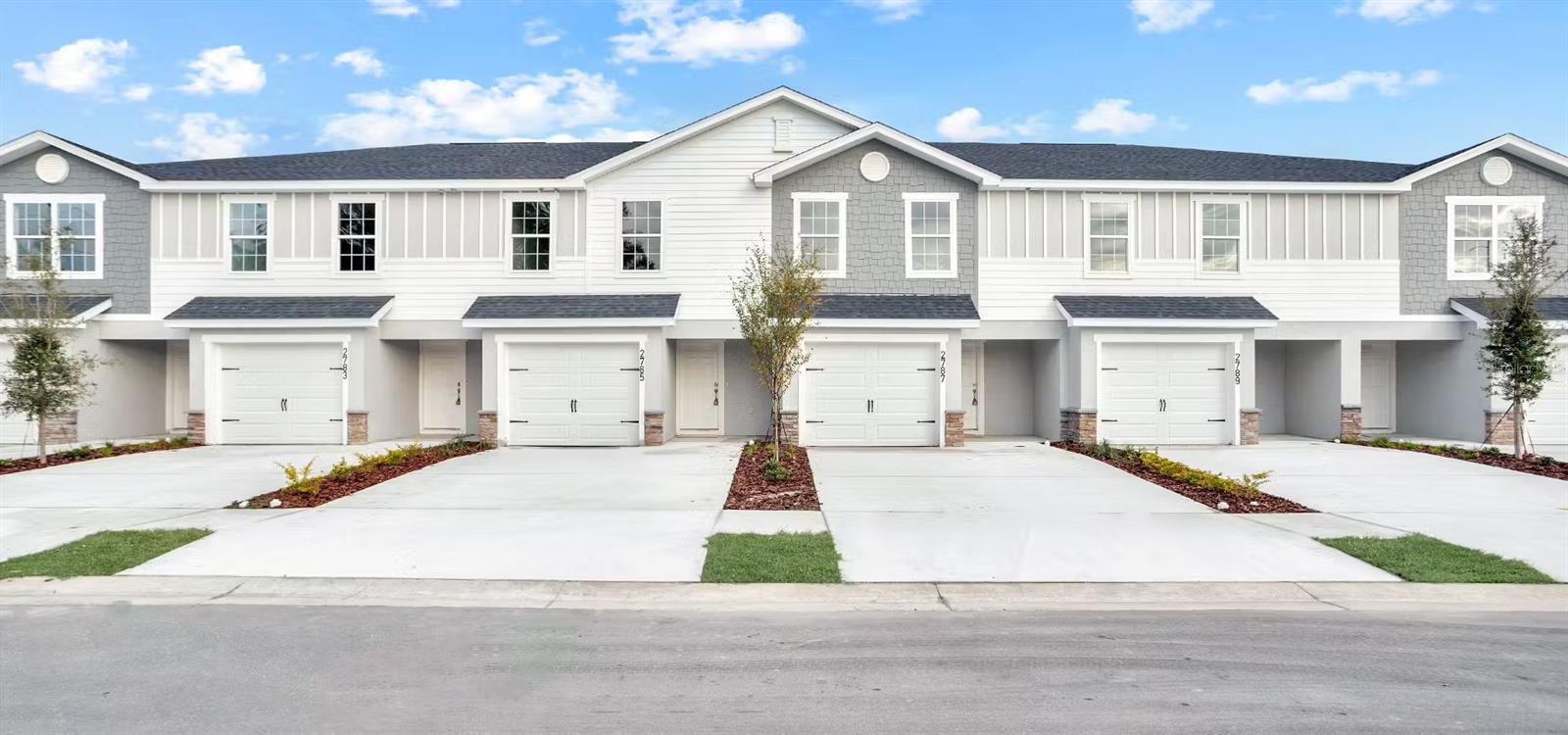 2-story new construction townhome with 1,713 square feet, 3 bedrooms, a 1-car garage, and a screened lanai, located in the brand-new Terrace at Walden Lake community offering natural and park amenities. Downstairs, enjoy an open layout and a gourmet kitchen with quartz countertops, shaker-style wood cabinets, Samsung stainless steel appliances, and a pantry. The spacious gathering room opens to your private screened lanai. The entire lower level and upstairs baths are finished with luxury vinyl plank flooring, with stain-resistant carpet in the bedrooms. Upstairs, you'll find three spacious bedrooms including your owner's suite complete with a walk-in wardrobe, linen closet, and a private en-suite bath with dual vanities and a tiled shower. Additional features for your convenience include a half bath downstairs, upstairs hall bath for the secondary bedrooms, custom-fit window blinds throughout, a Samsung full-sized washer and dryer, energy-efficient insulation and windows, and a full builder warranty.