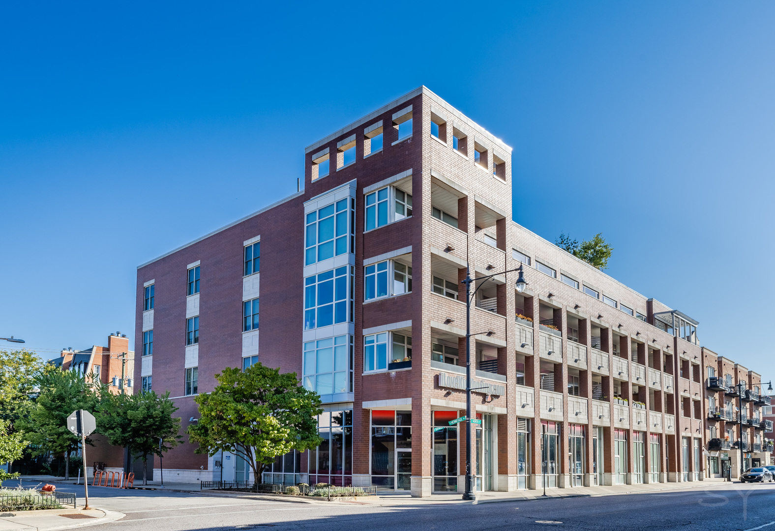 This luxury boutique property with a private elevator entry in the heart of Bucktown is like no other condo on the market. Conveniently located a short walk to the 606, Blue Line L, and 2 Metra Lines plus easy access to the Kennedy to get in/out of the city! A three bed two bath space spanning over 1850 Sq ft and two (oversized) outdoor spaces, all on a single level! Grill out on your front balcony, just off the living room w/ dedicated bar and beverage fridge, or enjoy Chicago summers with friends on your massive private roof deck on the same level as your unit. High-end finishes include quartz countertops, custom two-toned cabinetry and top of the line appliances to make the kitchen a chef's dream. The Master Suite has a large walk-in closet, attached master bath with double vanity, large walk-in shower w/ built-in bench, radiant heated floors and Grohe fixtures. In-unit washer/dryer in an oversized closet and attached heated garage w/ 2 spacious parking spaces wired for a personal charging station. It's like buying a new construction condo, but in a well established building.