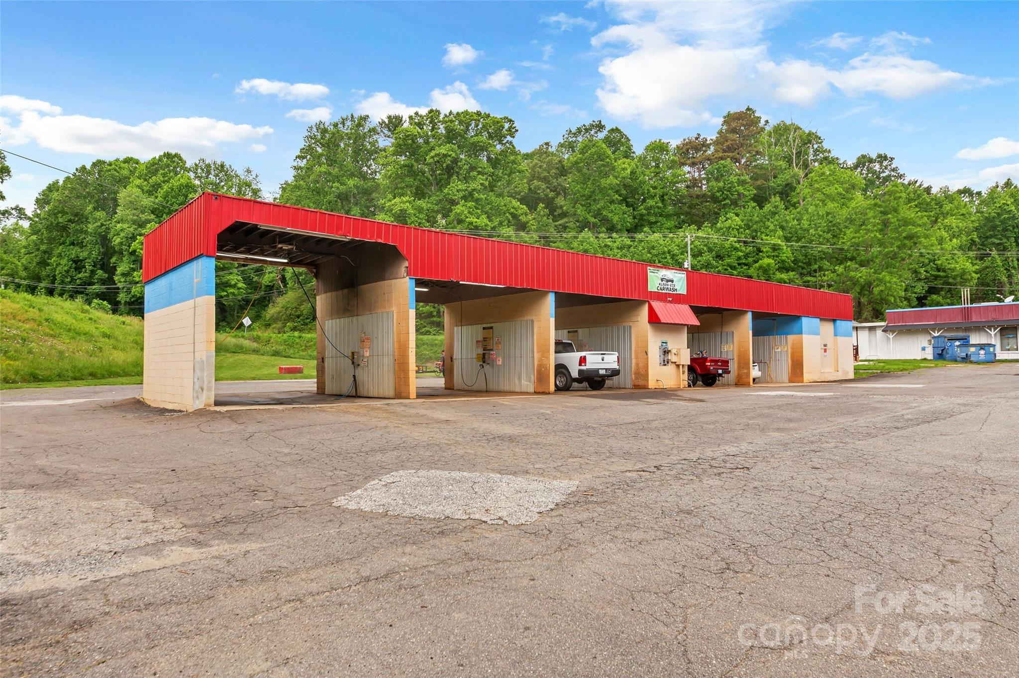 Operating car wash and approx 39 acres in opportunity zone ready for SFR, multi family or commercial development. Approx 33 acres of the vacant land is outside Marion city limits with no zoning and has close to 4 acres of elevated level ground with long range mountain views to the north. New recorded survey with marked boundaries. Publicly maintained paved roads allow extensive, easy access at multiple locations. City water and sewer available. Car wash has 5 bays, one for large transfer and dump trucks with new vacuums recently installed. One half mile from I-40 exit 86, 2.5 miles to downtown Marion.