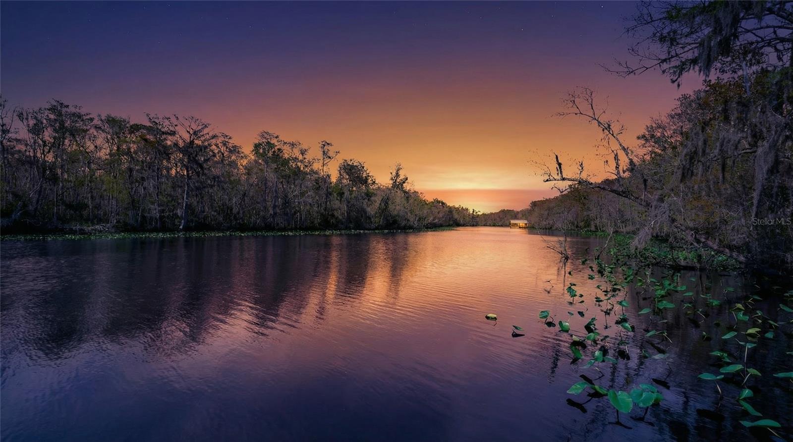 A Rare Waterfront Trifecta: Multi-Generational Living on Trout Creek Saint Augustine, FL - Discover an unparalleled waterfront estate at 6595 Collier Rd., a unique property offering three distinct living quarters on a sprawling almost 2.5-acre lot with direct access to the St. Johns River. This exceptional compound is a boater's paradise and a perfect solution for multi-generational families or those seeking significant rental income potential, all with the freedom of no HOA restrictions. Three Homes, One Unforgettable Property The estate is centered around a sprawling main residence of over 4,300 square feet. This primary home features four spacious bedrooms, and two-and-a-half baths, providing ample space for family and guests. Attached to the main house is a complete mother-in-law suite, thoughtfully designed for independence and comfort.This private apartment includes its own separate entrance, a living room, a full kitchen, two bedrooms, a full bathroom with laundry, and a dedicated one-car garage.Adding to the property's incredible value is a separate, standalone guest home. At approximately 1,000 square feet, this residence offers three bedrooms and two bathrooms and is metered separately, presenting a turnkey opportunity for a long-term rental or a private retreat for extended family.Resort-Style Outdoor LivingThe luxury experience extends to an incredible outdoor oasis designed for year-round enjoyment. A stunning heated pool serves as the centerpiece, surrounded by an expansive pool deck that seamlessly integrates with the main living areas. This deck is an entertainer's dream, featuring a cozy gas fireplace, a grill, and a convenient sink for effortless food preparation. With direct access from the master suite, the main living room, and the mother-in-law suite, the pool area is a central hub for relaxation and social gatherings. Just beyond the pool deck, a beautifully paved area awaits, offering another gas grill for larger cookouts and a hot tub for ultimate relaxation under the stars.The Ultimate Waterfront LifestyleNestled on the banks of the serene Trout Creek, the property offers a gateway to the majestic St. Johns River and the vibrant waterways of Northeast Florida. The estate is equipped with premier boating facilities, including a private dock with a robust 20,000-pound boat lift. Adjacent to the lift is a custom-built boathouse, fully outfitted with electricity, a mini-fridge, grill, sink, ice-maker, and a bar-creating the perfect hub for entertaining after a day on the water. A second dock provides a tranquil setting with a spacious deck, complete with plentiful seating and swings for enjoying the picturesque creek views.The property's location is a dream for any boating enthusiast, with two deep-water boat ramps offering bait and fuel located less than half a mile away. Furthermore, the area boasts several popular boat-up restaurants, allowing you to dock and dine at local favorites like Cap's on the Water and Aunt Kate's.This rare property on Collier Road is more than a home; it is a lifestyle. It offers a unique combination of spacious living, income potential, and unparalleled access to the water, all within the beautiful and historic landscape of Saint Augustine. Don't miss this opportunity to own a versatile waterfront legacy.