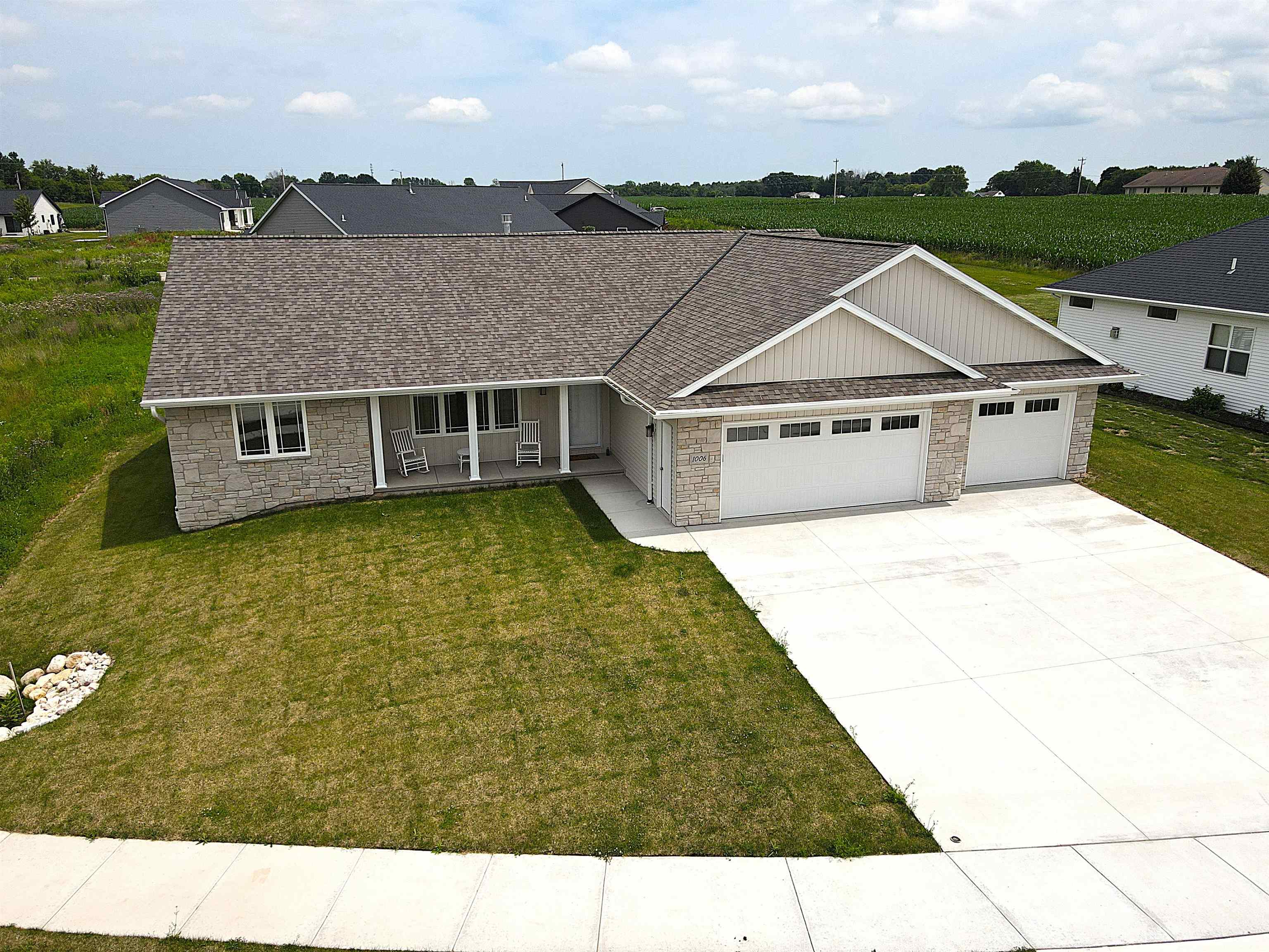 This better than new 3 bd 2 full bath gorgeous open concept split bedroom ranch built in 2024 is located on a fantastic cul-de-sac non-through street! Only lived in for a few months, this home boasts a pristine condition w/ the added benefit of new kitchen appliances, a washer & dryer, and landscaped front and back yard w/ sod and a new tree! The quality is obvious upon entering the home in the spacious living room complete w/ gas log fireplace. The kitchen boasts beautiful custom maple cabinets w/ a lg center island and walk-in pantry, lg 1st floor laundry, primary suite w/ walk-in closet, full bath w/ step in shower and double sink vanity. Spacious dining area, big 3+ car garage w/ trench drain, patio off the dinette, egress in lower along w/ rough-ins for future expansion!  A MUST SEE!