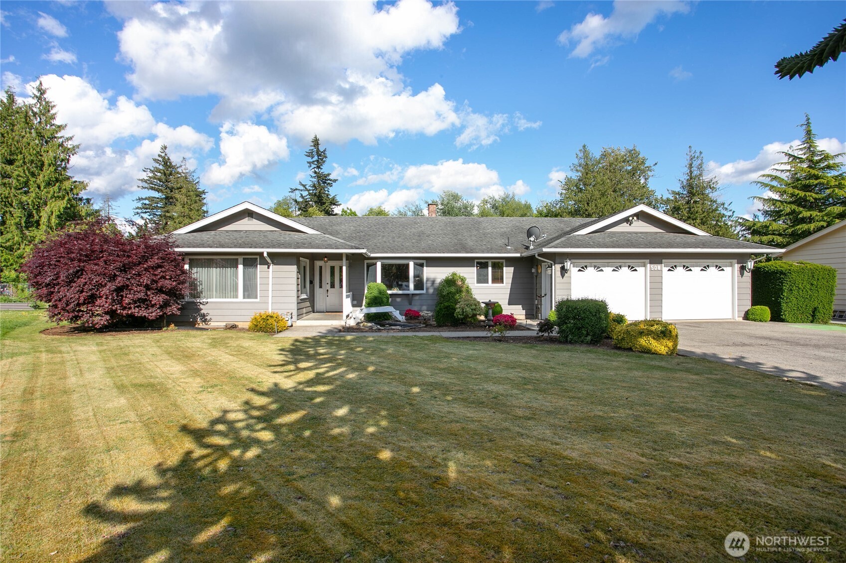 Welcome home to this shy 4,000 sq ft home on just over 13,000 sq ft parcel in sought after Village neighborhood! Very well-cared for custom one owner home, first time on market looking for buyer with Pinterest boards ready to go. They truly do not make homes like they used to - well appointed layout for entertaining, an abundance of built-in storage/cabinets and closets, Anderson wood casement windows, central vac, etc.  One story rambler w/spacious owner's suite (inc walk-in closet, direct access to hot tub patio, vanity & semi-shared full bath), 2nd bdrm, ginormous living room with french doors, great size dining off kitchen, sitting room & sunroom. So many possibilities in full size basement with access to outside at top of steps - great for multi-gen living or potential secondary income. Basement boasts huge rec room, 3rd bdrm with 3/4 ensuite bath & walk-in closet, plus another large flex room. Great location in cul-de-sac w/extra-large town lot backing to city-owned creek land minutes from amenities on coveted westside of town. Enjoy ample parking & your very own shuffleboard in the front and plenty of room to play in the back! Truly a gem you must see.