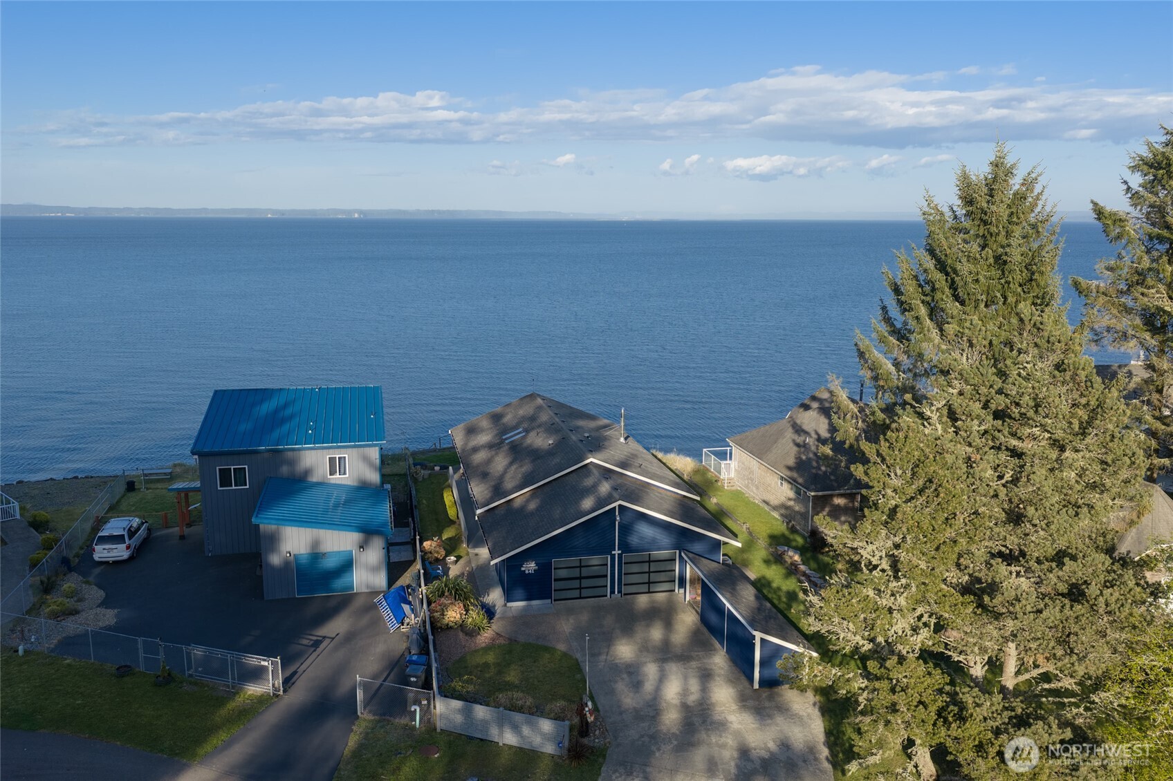 If you have ever imagined being in a peaceful place with incredible changing views daily, come view an affordable slice of heaven from a Bay Front Home that is as close as you can get to the action. This fantastic location allows views of all the Olympic Mountain peaks as well as Mt Rainier in the Cascade Mountain range from the same window. Watch as the scenery changes twice every day with ebb and flow of the Bay water tides. Water fowl and wildlife are frequent guests for viewing, as well as amazing sunrises in the mornings. This roomy 2 Bedroom and 2 Bath home has vaulted ceilings and windows galore for viewing. Skylights, tube lights, a ceiling fan, and a wood-burning free-standing fireplace, provide a comfortable and cozy environment to enjoy our front row seat to natures finest viewing. Tons of storage including a 7x28 shed. Enjoy the outdoors on the generous 464 sq.ft. Deck with a ramp approach, or be creative in your huge 816 sq.ft. Garage. This home is a member of the Community Club with dues of approx. $215 annually (the Club is not an HOA, but it is recorded on the Deed). This home is also located close to the Community Club and Oyhut Bay, and is also in one of the warmer locations on the peninsula with a very low crime rate. This one is worth viewing and is available at an affordable price, so don't miss out on viewing this home if you ever dreamed of living on the Bay.