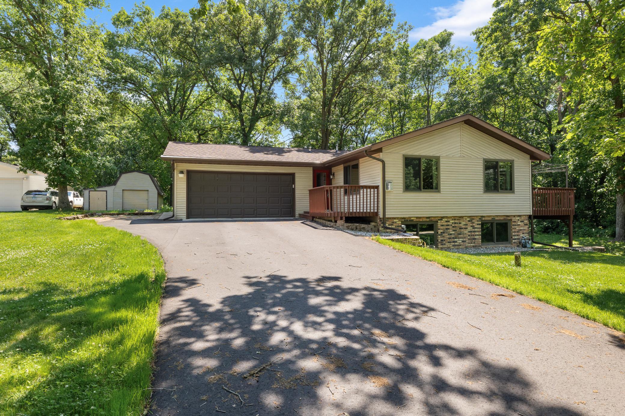 Charming 4-bed, 2-bath rambler on nearly ½ acre in Little Falls with deeded Mississippi River access—conveniently located close to town! Enjoy a peaceful, tree-lined setting with a backyard easement leading right to the river—perfect for a future dock, boating, fishing, or simply relaxing by the water. A spacious 12x38 deck provides the perfect spot for outdoor entertaining or unwinding. Bright and inviting main level features a cozy free standing gas fireplace, newer windows, furnace, and central air. Lower level kitchenette adds great flexibility for guests or potential rental. Newer septic, storage shed, and plenty of space to enjoy the outdoors. A wonderful blend of comfort, charm, and nature!