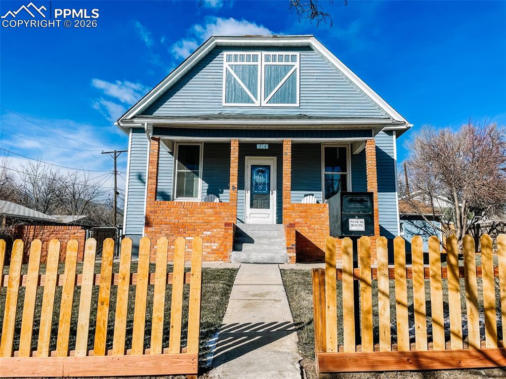 This beautifully preserved 1902 Westside residence in the heart of Old Colorado City offers a sophisticated blend of timeless character and thoughtfully curated modern living. Original wood floors, soaring ceilings, rich wood trim, and elegant built-ins in the dining room create a warm, architectural presence throughout the home, while expansive windows frame views of Pikes Peak from most rooms, including the kitchen.The expansive gourmet kitchen is both striking and functional, featuring travertine tile, concrete countertops, stainless steel appliances, distinctive lighting, generous cabinetry, and a large pantry, with space for casual dining, all set against mountain views that elevate everyday living. The main level includes two well-proportioned bedrooms and a stylishly updated full bathroom.The fully finished lower level adds remarkable flexibility, offering a comfortable family room, second kitchen, two additional bedrooms, and a beautifully renovated full bath. With two separate entrances, the home can be enjoyed as a single refined residence or thoughtfully utilized as two private living spaces, ideal for multigenerational living or discreet income potential.The property holds an active Airbnb permit, offering short-term rental flexibility buyer to verify continuation per city regulations. The home is offered fully furnished, creating a rare turnkey opportunity.Outdoors, the grounds are equally inviting. The fully fenced yard includes a dedicated dog run and garden area, mature apple trees, a shed, sprinkler system, and a detached two-car garage, creating a rare balance of charm, function, and lifestyle. Across the street, enjoy immediate access to a public park with dog-friendly open space, playgrounds, a quarter-mile running track, and fitness stations, offering year-round recreation without sacrificing privacy or quiet.Square footage differs from assessor records. Buyer to verify all information including square footage.