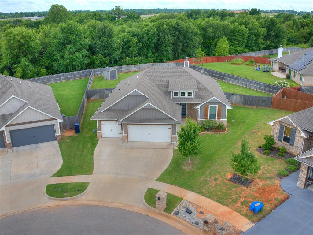 This upgraded home has everything you need and more. Built in November 2020 by Taber Homes (Hummingbird design), it sits on a quiet cul-de-sac with a huge backyard, offering plenty of space for outdoor fun, gardening, or relaxing. The location is ideal—less than a mile from the new Kilpatrick Turnpike and Morgan Road, within Mustang Schools but inside Oklahoma City limits. The home features 4 bedrooms, 2 bathrooms, and 1,813 square feet of living space with an open floor plan that connects the living and dining areas, making it perfect for gatherings. The kitchen is a dream, complete with granite countertops, ceiling-height cabinets, under-cabinet lighting, a large pantry, stainless steel appliances, a gas stove, a built-in oven and microwave, a spacious island with a hidden trash drawer, and a stylish farmhouse stainless steel sink. The master suite includes a walk-in shower, a jetted tub, and two large walk-in closets for extra storage. Step outside to the 185-square-foot covered patio, which includes a wood-burning fireplace, a gas line ready for your BBQ grill, and is TV-ready—perfect for entertaining year-round. Other standout features include cathedral ceilings, an oversized 3-car garage with an in-ground storm shelter, a security system, trendy faux wood blinds throughout, full home guttering, dusk-to-dawn outdoor lighting, a tankless hot water heater, a sprinkler system, and a storage shed in the backyard. This home offers the perfect blend of comfort, style, and space, both inside and out.