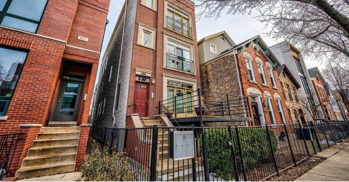 Spacious 3BR/2.1BA Duplex Down with Garage Parking & 4 Outdoor Spaces in Prime East Village! Welcome to this expansive 2,200+ sq ft duplex down in the heart of East Village, offering an ideal blend of space, comfort, and location. Featuring 3 true bedrooms, 2 full bathrooms, 1 half-bath and 4 private outdoor spaces, this home lives like a single-family! The main level boasts natural hardwood floors, a sunlit open-concept living/dining area with 2 fireplaces, and built-in surround sound speakers-perfect for entertaining. The kitchen opens to a front deck and includes ample cabinetry, granite countertops, and stainless steel appliances. Downstairs, enjoy oversized bedrooms with brand-new carpet, abundant storage, and massive bathrooms, including a primary suite with dual vanities, a walk-in shower, and soaking tub. In-unit Maytag washer/dryer, central heat and air, and garage parking included in price. Sold AS/IS, perfect for buyers who want to personalize or add value. Ideally located on a quiet, tree-lined street just steps to Division Street dining, shopping, and Blue Line transit.  Don't miss this rare opportunity to own a true duplex down with unbeatable square footage and outdoor space in one of Chicago's most vibrant neighborhoods!