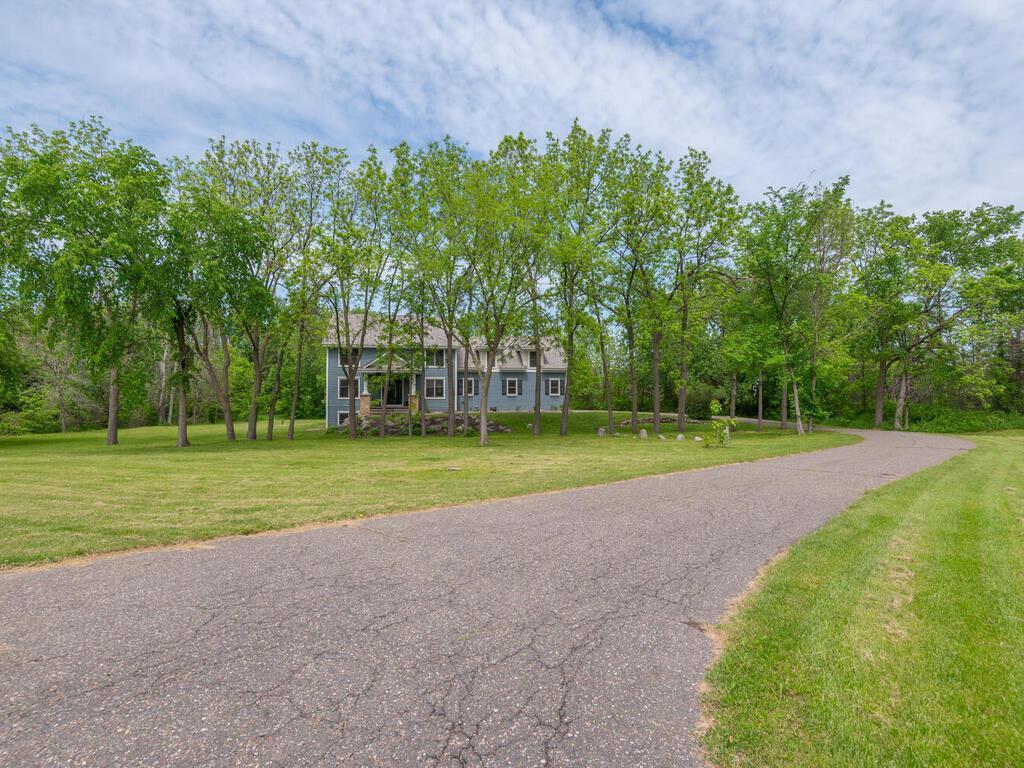 Contract for Deed available. Custom executive home in a private gated community set on a picturesque 3 acre lot. Fully renovated. Other homes in development range from 7,000-10,000 sq/ft with sport courts and indoor/outdoor pools. Customize this home or move-in ready. Exquisite finishes, desirable amenities and private pond. Upstairs bedroom/bonus room has own entrance and kitchenette. Can be divided into more bedrooms or used as a business. In-law suite in lower level has separate entrance and own garage stall as well. Black walnut trees are a maturing investment on property and valued based on size. Open main floor flows from gourmet kitchen with walk-in pantry to great room with large windows overlooking pond. The primary suite features a private bath with double vanity, walk-in shower, separate stand-alone tub and enormous walk-in closet.  Upper level has three bedrooms and a fourth bonus room with partial kitchen and another separate entrance which can be used as bedroom(s) or a business. Lower level includes a Mother-in-law suite with walk-in closet, its own kitchenette, private bath and separate access with garage stall. Garage is insulated and heated with built in car wash. In addition to a fully renovated interior, the exterior has been repainted, new cedar roof, new deck, brand new furnace and air conditioner, new water osmosis system and Kinetico water treatment.