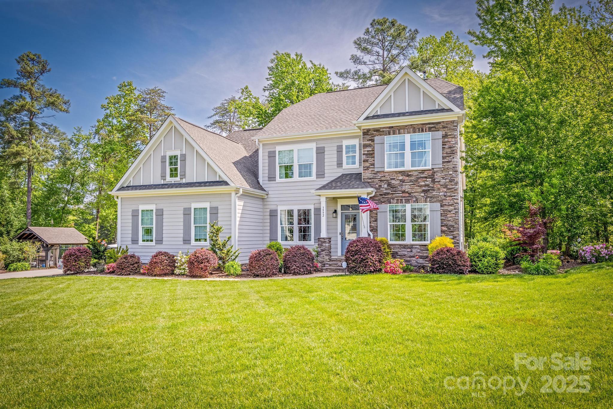 Presenting a premier Lake Norman waterfront residence with 191’ of shoreline, offering exceptional lakefront living. Built by Copper Builders in 2017, this 3,458 sq ft custom home features a private dock with 2 boat lifts, 1 jet ski port, & a heated saltwater pool. Outdoor amenities include a Gazebo, patio, wood-burning fireplace, gas fire pit, &  an outdoor kitchen. The interior showcases a white gourmet kitchen with a gas cooktop, large island, and refined finishes. Enjoy lake views from multiple rooms. The main floor includes a spacious primary suite, office with French doors, & formal dining room. The 2nd level offers 3 bedrooms, 2 full baths, & a huge bonus room. Additional features include an large finished pull-down attic, a rear deck with covered section,  epoxy finished 3 car garage, & lake-fed irrigation. Includes a greenhouse, garden areas, & access to community pool, lake access, & boat storage. Convenient commute to Charlotte & airport. Listed below appraised value!