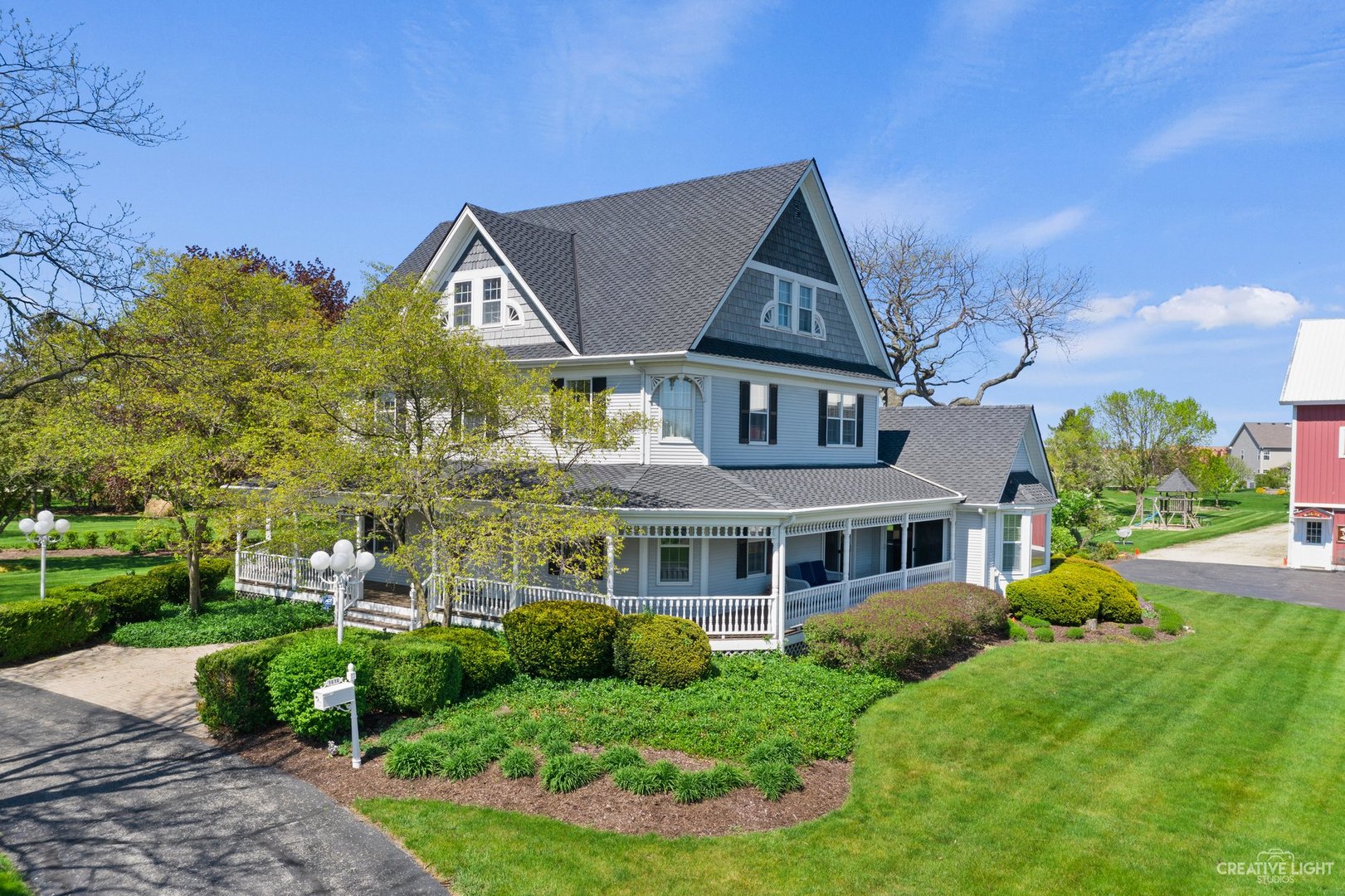 Welcome to the City Farm! Truly one of a kind historic property originally built in 1905. The beautifully restored farmhouse is situated on 5 acres with a variety of out-buildings including a full apartment / in-law suite. The home is 3 stories and has 5 bedrooms, 31/2 baths, and 5,112 square feet of living space. Additional apartment unit features a bedroom, full bathroom, utility room with laundry, and beautiful kitchen with a 2,500 square foot entertainment room / gym / conference center.    The farmhouse gourmet kitchen boasts granite countertops, high-end appliances including a double oven, bottom load refrigerator and additional built-in Sub-Zero refrigerator & freezer. The second floor features the master suite which includes a luxury master bath complete with oversize walk-in shower with wall jets, plus beautiful stand alone claw tub. Two more nice sized bedrooms complete the second floor. On the third floor, find 2 additional bedrooms with amazing views and a loft/game area. The front porch wraps around three sides of the home with access from the kitchen, front door and family room. The two-tiered back deck includes a gazebo and a view of the 1/4 acre private swimming/fishing pond.  Brand New Roof installed last week on 3-Car Garage and Playset.   Historic barn also includes a sport court with basketball, volleyball, and baseball / golf practice nets. 3 horse stalls plus another huge loft upstairs for more storage/rooms. Pole barn also includes another 2,500 square feet of open storage, and 800 square feet of locked storage! The property also has a 3+ car heated garage with more storage above, and a 70' silo with an additional 500 square foot storage building. One could easily park 20 cars in covered space on this property. All of this and it's close to downtown Oswego, schools, parks and walking paths.