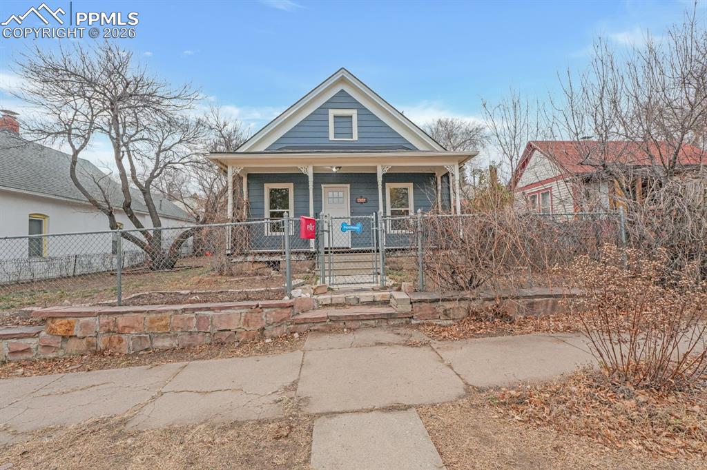 1909 Westside charmer offering the perfect blend of historic character and modern updates. Enjoy brand-new luxury vinyl plank flooring throughout the entire main level and fresh interior paint. This home is move-in-ready.The updated kitchen features newer-style cabinetry, updated countertops, a newer faucet, and a custom standalone pantry—a rare and welcome bonus. All windows have been replaced with updated vinyl windows, and the home includes a GE electrical panel for added peace of mind.The updated bathroom showcases tile flooring, granite-style formica countertops, an updated sink, and modern fixtures. The home offers three generously sized bedrooms, including a spacious primary bedroom with walk-out access to the large concrete patio—perfect for indoor/outdoor living.Additional highlights include full-size main-level laundry, ceiling fans, an exceptionally deep crawlspace (nearly 6 feet) ideal for substantial storage, and ample off-street parking. The 19’ x 12’ shed has its own electrical panel is wired and equipped with an EV Ford electric car charger, making it both functional and forward-thinking.A wonderful opportunity on the Westside with thoughtful updates, storage, and convenience throughout.