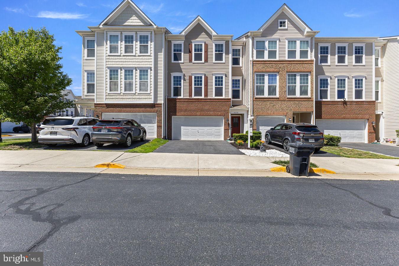 Welcome to this beautifully maintained and thoughtfully upgraded 3-story townhome in the heart of Aldie's sought-after Cedarwood community at Stone Ridge. Offering spacious, elegant living with exceptional functionality on every level, this impressive residence is the perfect blend of modern comfort and timeless style. The second-floor gourmet kitchen features stainless steel appliances, granite countertops, an oversized center island, and abundant cabinetry with direct access to the upgraded Trex composite deck, ideal for entertaining or relaxing outdoors. The open-concept family room flows seamlessly from the kitchen with a cozy gas fireplace as its centerpiece, while formal living and dining areas provide additional versatility for everyday life and special occasions. Upstairs, the luxurious primary suite boasts tray ceilings, two individual walk-in closets, and a spa-inspired en-suite bath, with additional bedrooms offering generous proportions and abundant natural light. The fully finished ground floor delivers outstanding flexibility, use it as a spacious recreation room or configure it as a private bedroom with an attached full bathroom, ideal for guests, multi-generational living, or a home office. Step outside to the large stamped concrete patio, perfect for hosting outdoor gatherings or enjoying a bonfire with friends and family.Since 2022, the home has been thoughtfully improved with numerous major upgrades including the stamped concrete patio, premium Trex composite decking, a new cooktop and refrigerator, a dedicated 60-amp EV charging circuit in the garage, a new outdoor AC condenser unit, upgraded high-capacity bathroom exhaust fans, fresh interior paint throughout, custom built-in cabinetry, updated flooring on the lower level, newer carpeting on stairs and all bedrooms, ceiling fans, and garage storage solutions, reflecting true pride of ownership.Located in the family-friendly Cedarwood neighborhood, residents enjoy exceptional HOA amenities including 3 swimming pools, tennis, basketball and pickleball courts, a gym, and 2 rentable party/event halls, with an active HOA organizing community events year-round. The home is walkable to Goshen Post/Arcola Elementary and John Champe High School, steps from Stone Ridge Village Center for shopping and dining, and walkable to the Dulles South Stone Ridge II Park & Ride for easy commuting. This move-in-ready home presents an exceptional opportunity in one of Loudoun County's most sought-after communities.