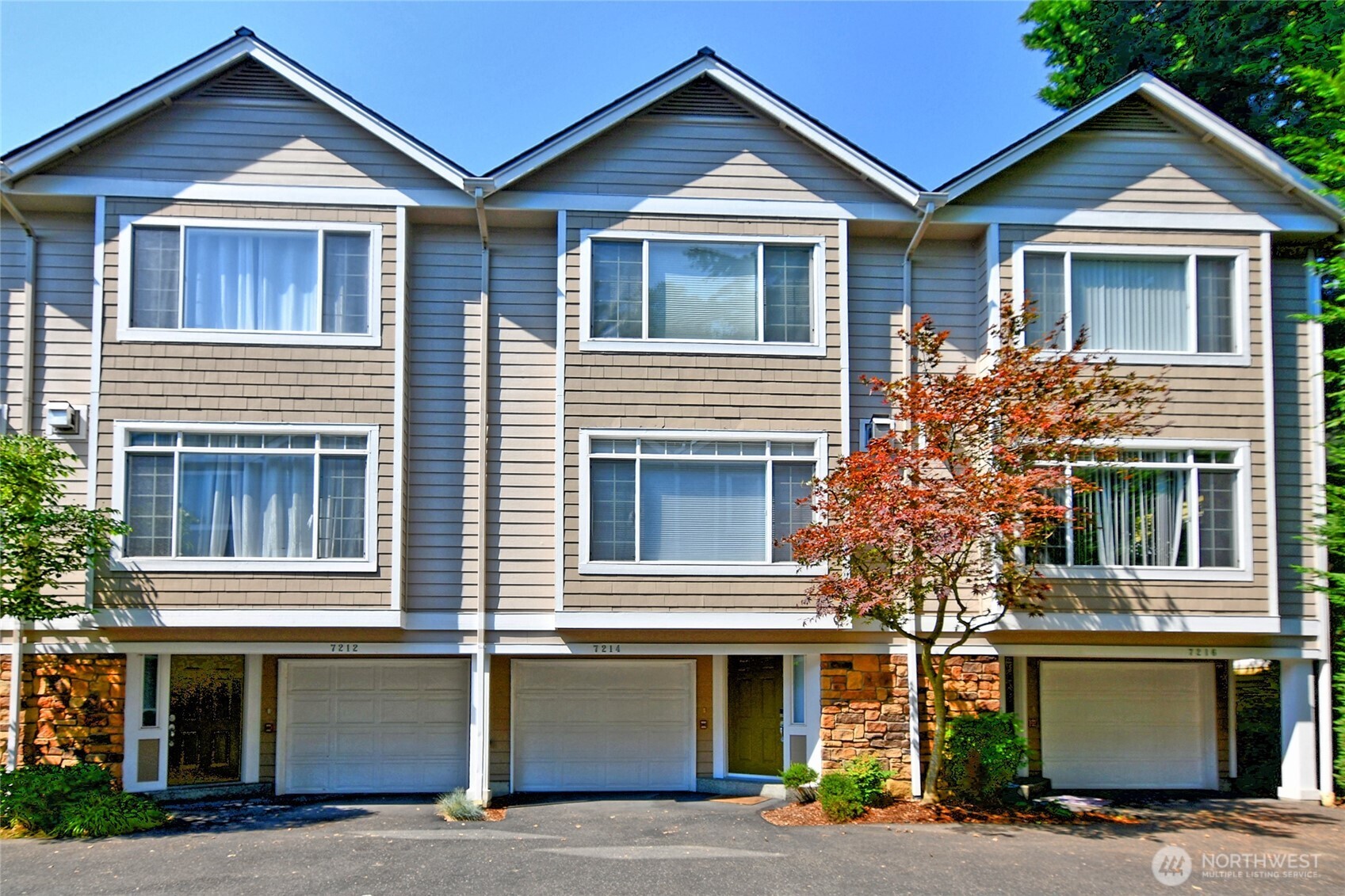 Spacious townhouse ideally located near everything Kenmore has to offer. This beautifully updated home features an  open-concept floor plan with a remodeled kitchen that seamlessly connects to the dining and living areas, creating the  perfect space for entertaining. The kitchen includes brand-new cabinets, modern updates, and plenty of storage.  Enjoy a newly remodeled bathroom with a stylish updated shower, new carpet, fresh interior paint, and new double-pane  storm windows for added comfort and energy efficiency. Relax on the private deck off the kitchen during the summer  months or cozy up next to the gas fireplace during the colder seasons.  Upstairs, you’ll find two spacious bedrooms, including a primary suite with an ensuite bathroom and separate closets.  Conveniently located near Lake Washington, the Burke-Gilman Trail, and the Park & Ride. Complete with two garage  parking spaces, this home offers the perfect blend of comfort, convenience, and modern updates.