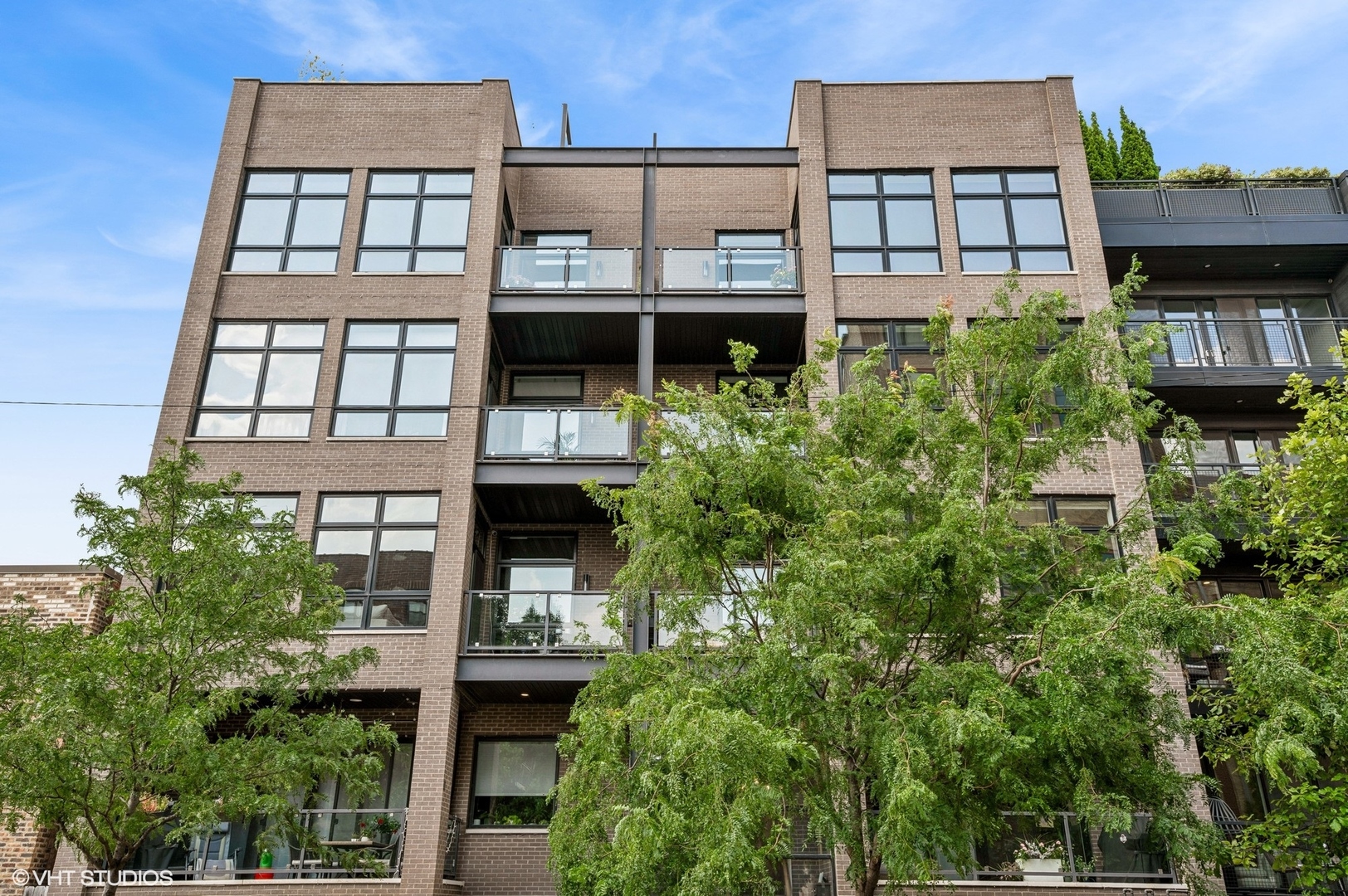 Stunning 3 bedroom 2.1 bath condo in wonderful boutique 8-unit elevator building. At the nexus of West Town, River North and Fulton Market. Modern and open 1927 sq. ft. floor plan with huge windows and amazing south exposure. Unit is flooded with light. Wonderful, highly upgraded kitchen featuring Bosch, Sub-Zero and Miele appliances, Italian cabinetry, Caesarstone countertops. Primary bedroom features great organized closet, wonderful bath with double vanity, soaking tub, and radiant heated floors. Unit has 4" solid oak floors, GBFP, upgraded light fixtures, motorized blinds, and Nest system. Unit has large (17x23) private rear deck over the garage with new pressure treated lumber and a lovely front terrace off the public rooms.Full masonry building with concrete floors. 9.5"+ ceilings throughout the unit. 1 car garage parking with EV charging station. Location is ideal: a 10 minute walk to the Grand Ave Blue Line stop, 2 minute drive to 90/94, close to Randolph Street and Loop. Perfect neutral decor. Move right in.