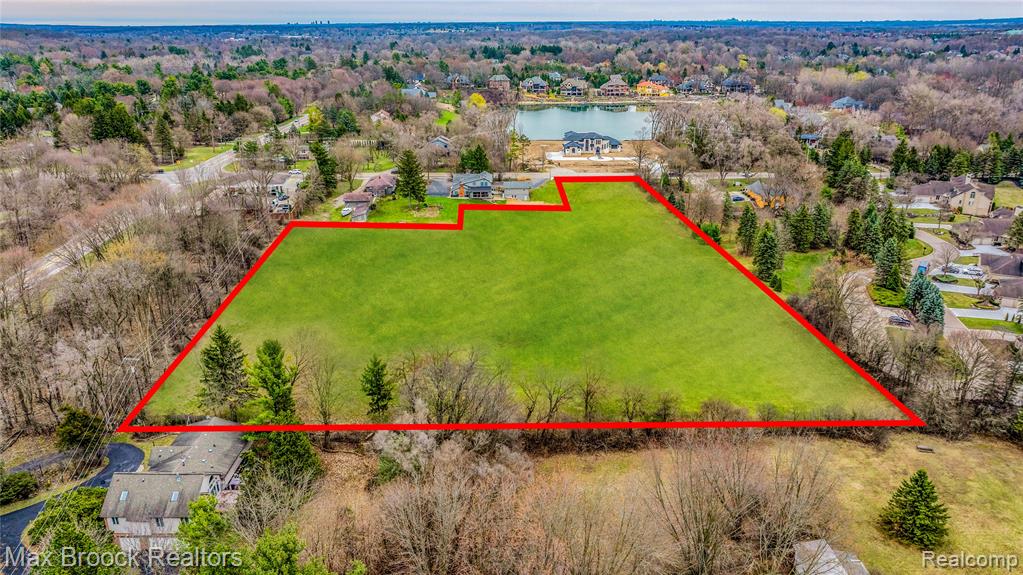 Discover a remarkable canvas in the heart of an esteemed community, where the allure of open space beckons visionaries, builders, and those yearning for a custom forever home. This is a unique chance to own a significant slice of serenity—a sprawling estimated 5-acre parcel, positioned perfectly for those who appreciate the proximity to the vibrant Downtown Northville while relishing in the tranquility of a private oasis. An ideal landscape for developers and builders, this land presents an extraordinary opportunity to craft a variety of residential options. Envision creating an intimate enclave of luxury homes, a sleek complex of townhomes, condos, or upscale apartments that offer a blend of modern living and the warmth of community. The expanse affords flexibility and creativity in design, allowing for a development that can cater to the most discerning of tastes and lifestyles. For the individual dreamer looking to lay down roots, imagine designing your bespoke residence, with every detail tailored to your desires. Whether it's a grand estate surrounded by nature or a sustainable, eco-friendly dwelling, this land serves as the ultimate foundation for your vision. While the property is a near-blank slate, water access is conveniently located across the road. The new owner will be responsible for facilitating public sewer access to the site (if developer), with the current service termination nearby (Blue Heron), adding value to this promising venture. All prospective buyers should undertake due diligence with the local township to verify the feasibility of their intended plans. Don't miss this rare chance to transform one of the last large open parcels of land in this coveted location into a legacy of luxury living or a groundbreaking development. The possibilities are as limitless as your imagination. Lot lines are proposed are used for example purposes only, true lot lines will be determined by buyers survey.