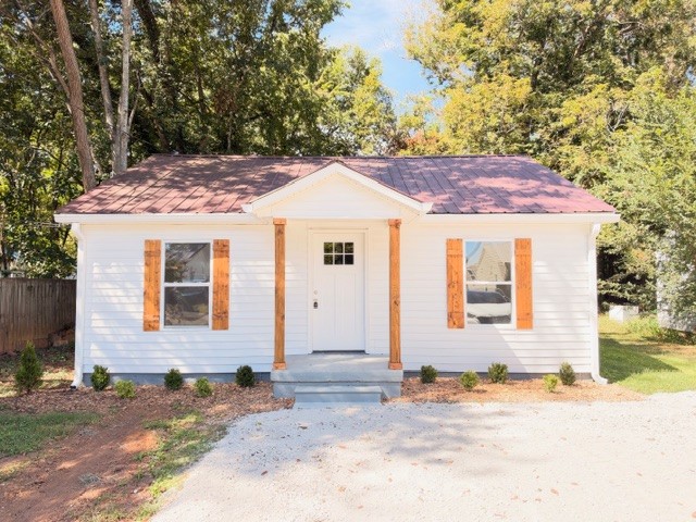 Take A Look!! This adorable totally renovated 2-bedroom, 1-bath cottage that blends cozy charm with fresh modern updates! Step inside to find beautiful LVT flooring throughout, a bright and inviting interior, and an updated kitchen featuring stainless steel appliances. The bathroom has been refreshed with stylish tile surrounding the bathtub, adding a clean, modern touch. Outside you will appreciate the durability and low maintenance of the metal roof. Conveniently located close to town, shopping, dining, and everyday amenities, this charmer would make a wonderful starter home, downsizing option, or investment property.