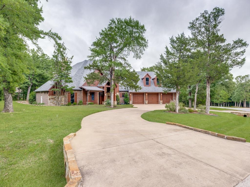 Beautifully appointed ranch-style home in the prestigious golf course lake community of Rock Creek, offering the perfect blend of luxury, comfort, and resort-style living. This spacious 4-bedroom residence features two private primary suites, ideal for multi-generational living or hosting guests in style.Designed for entertaining, the open-concept floor plan flows seamlessly into the gourmet kitchen which is a chef’s dream with a gas cooktop, double ovens, pot filler, oversized island and abundant prep space. A charming wine grotto adds a unique touch for collectors and entertainers alike. Second level generous game room complete with a Brunswick pool table and seating for the movie enthusiast. A private balcony off the game room offers additional outdoor space to relax and unwind. Step outside off the family living to an incredible screened-in back patio featuring a fireplace, built-in grill with vent hood, wine-beverage refrigerator, and inviting living area for year-round enjoyment. The backyard is equally impressive with a putting green and a built-in fire pit area perfect for gathering under the stars. Offered fully furnished, this exceptional Lake Texoma home is move-in ready and provides a rare opportunity to enjoy upscale living in one of the area’s most sought-after lake and golf communities.