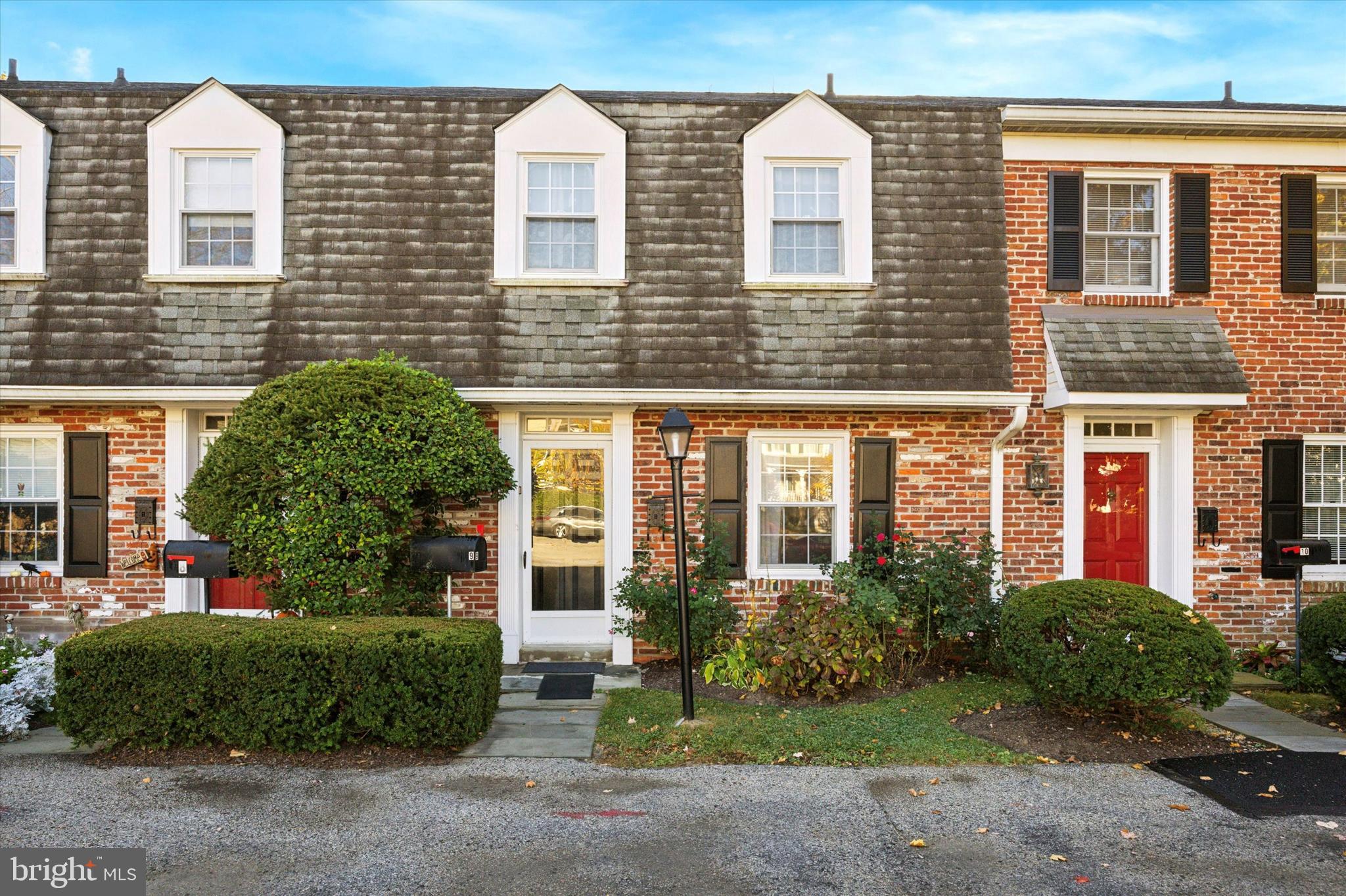 This charming brick townhome in Haverford offers easy living and a prime location in Lower Merion Township. The first and second floors feature beautiful hardwood flooring, while the kitchen boasts a white quartz countertop and a separate eating area. The living area includes a cozy fireplace and a convenient half bath on the main floor. Sliding doors open to a private back patio, perfect for outdoor enjoyment. Upstairs, you'll find two generously sized bedrooms, each with its own bathroom. The large unfinished basement provides ample storage and laundry space. There are parking spaces right in front of the property, and it is close to the train and an easy drive to the city.