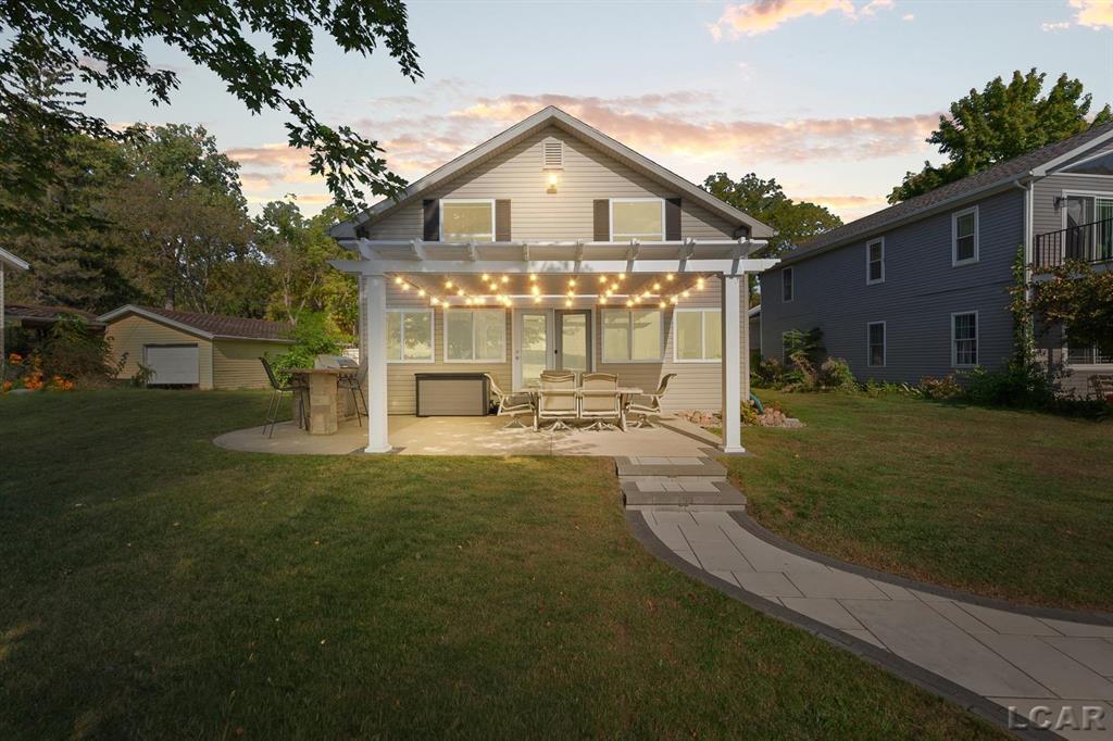 Experience the ultimate in lakeside living with this stunning 4-bedroom, 1.5-bathroom home, with over 1,700 square feet, on the highly sought-after Sand Lake. Nestled on nearly a quarter acre, this property boasts an oversized garage and ample parking, ensuring convenience for you and your guests. With 50 feet of pristine lake frontage, you can savor breathtaking views and the tranquility that comes with lake life. Don't miss your chance to embrace the serenity of this exceptional home today! Being Sold fully furnished, also including all 11 sections of the dock and the 12'x12' aluminum platform on water deck pictured.