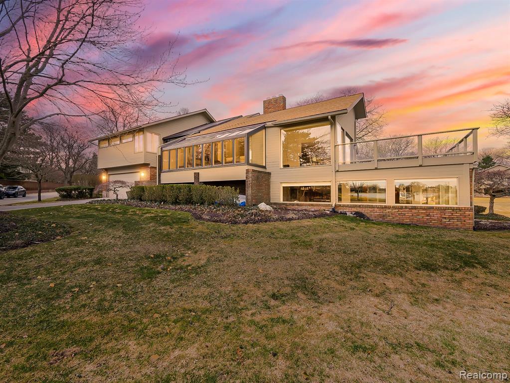 Pine Lake frontage in a prime, highly sought-after location! This beautifully maintained detached condo is thoughtfully designed to capture the essence of lakefront living on all-sports Pine Lake. Enjoy effortless indoor-outdoor living with stunning lake views and welcoming outdoor spaces perfect for relaxing or entertaining.The main level showcases hardwood flooring and an open-concept living and dining area with soaring vaulted ceilings, skylights, and walls of windows that fill the home with natural light and lead to a spacious Trex deck overlooking the water.The well-appointed kitchen is designed by John Morgan. Custom built-ins throughout designed by Vogue Furniture adding both style and function throughout the home. A private library, convenient first-floor laundry, and a half bath complete the main level.Upstairs, the expansive primary suite offers a peaceful retreat, featuring a generous en-suite bath with a steam shower and abundant closet and storage space. The finished walkout lower level provides additional living space, a full bath, and direct access to the back patio.Additional highlights include a 2-car attached garage, backup generator, and lake privileges, with the opportunity for a boat slip (subject to waitlist).This is lake living at its finest—comfortable, elegant, and ready to enjoy.