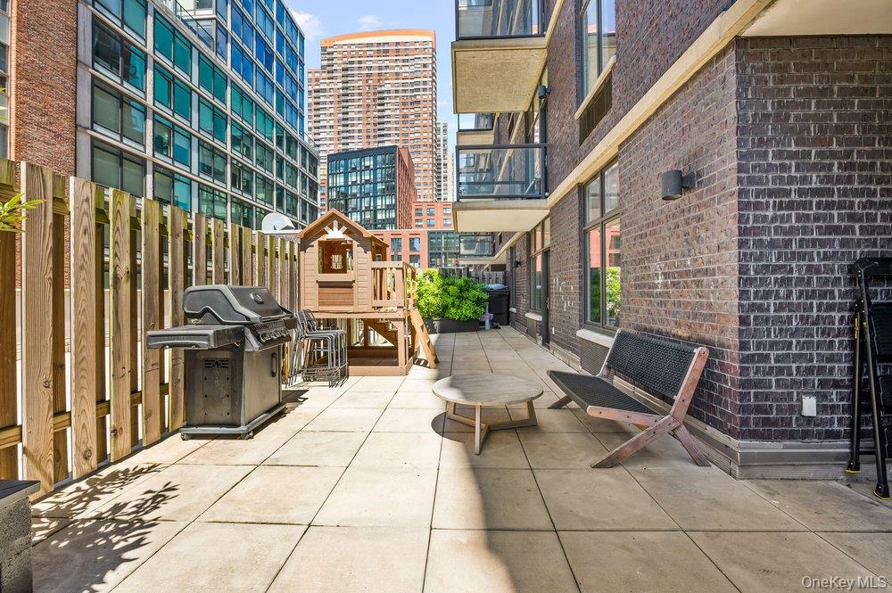 Rare 3 Bed / 2 Bath with Expansive 1,391 SF Interior & 571 SF Private Terrace at The YardThis rarely available 3-bedroom, 2-bathroom residence in prime Hunters Point offers approximately 1,391 square feet of interior space and an exceptional 571 square foot private terrace—delivering one of the most compelling indoor-outdoor layouts in a full three-bedroom Long Island City condo.The well-designed bedroom layout provides excellent separation of space, while the open living and dining area features newly updated flooring and flows directly to the terrace from both the living room and primary suite. Oversized windows bring in abundant natural light and enhance the home’s airy, open feel.A true standout is the expansive private terrace, offering generous space for dining, lounging, and entertaining—an uncommon outdoor footprint for a Hunters Point condo of this size.All three bedrooms are exceptionally well-proportioned, highlighted by a massive primary suite large enough to accommodate a sleeping area, lounge space, and home office setup, along with direct terrace access and a custom walk-in closet.Storage is a defining feature of the home, with seven custom closets throughout—most outfitted with Elfa shelving systems, offering highly efficient, flexible, and buyer-customizable organization.The kitchen is outfitted with high-end finishes including lacquered cabinetry, Caesarstone countertops and backsplash, a Viking 6-burner range, Wolf hood, Miele dishwasher, and LG smart, large-capacity washer/dryer discreetly located within a custom closet in the bathroom, along with a reverse osmosis water filtration system.Both bathrooms feature premium finishes including Hansgrohe fixtures, travertine tile, glass accents, and custom walnut cabinetry. The primary bath includes a soaking tub, rainfall shower, and double vanity.Residents enjoy full-service amenities including a roof deck with BBQ grills and skyline views, a resident lounge, fitness center, an attended lobby, and a secure Swiftlane smart access system.Located moments from Gantry Plaza State Park, the East River Ferry, and the 7 train, offering easy access to Manhattan and the best of Hunters Point waterfront living.