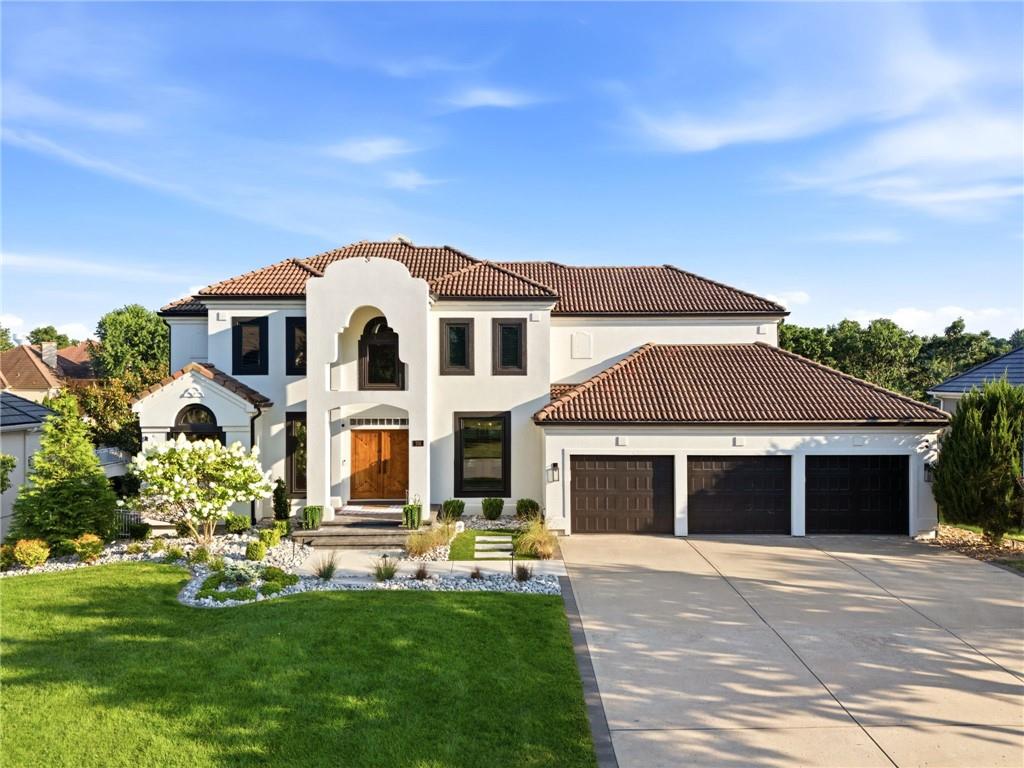 Luxury lakefront living awaits in one of Lakewood's premier waterfront homes! Situated on a first-tier lot with breathtaking lake views, this custom home offers over 5,300 sq. ft. of beautifully updated living space. The chef's kitchen features custom cabinetry, an oversized island, premium appliances, and stunning water views. The dramatic two-story great room boasts soaring ceilings, hardwood floors, designer lighting, and a floor-to-ceiling fireplace. The main-level primary suite offers a fireplace, spa-like bath, walk-in closet, and lake views. The finished walkout lower level provides additional living and entertaining space. Recent improvements include new windows (with enlarged lake-view windows), custom electric shutters, fresh interior paint, designer lighting, new landscaping and hardscaping, expanded front entry with black pavers, repaired retaining wall, new paver walkway to the lake, attic insulation replacement, and garage mudroom. Enjoy multiple outdoor living spaces overlooking the water plus Lakewood amenities including boating, golf, pools, tennis, pickleball, trails, clubhouse, and more. A rare opportunity to own one of Lakewood's finest waterfront properties!