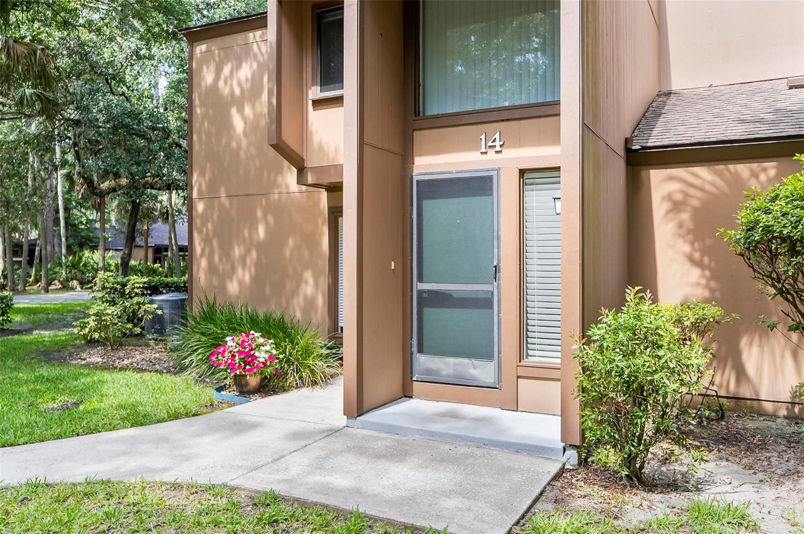 This nicely located second-story 2-bedroom, 2-bath condo was recently painted with newer carpet and is located in the established Fairways community offers a perfect blend of convenience and tranquility, nestled beneath a breathtaking canopy of majestic oak trees. The spacious primary suite provides privacy and comfort, with direct access to an expansive screened porch, seamlessly connecting indoor and outdoor living. A versatile second bedroom is ideal for guests or a stylish home office, while bright, open living and dining areas create an inviting atmosphere. Residents enjoy the relaxing amenities, including a heated and screened community pool, sauna, clubhouse, game room, library, full kitchen, and tennis courts. Located just minutes from Jungle Hut Beach and the lively European Village, this home places you at the heart of Palm Coast’s best entertainment, shopping, and dining. Don’t miss your chance to own this extraordinary piece of paradise! A/C replaced 2023.