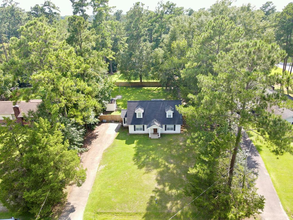 Desirable South Side Home!  Welcome to this beautifully updated home, conveniently located on the south side of Thomasville-ideal for those commuting to Tallahassee, FL. This inviting residence features a remodeled kitchen with sparkling granite countertops and sleek stainless steel appliances. Both bathrooms have been renovated and the master bath has two vanity rooms with granite and a walk through bath area for privacy getting ready from your partner. Enjoy privacy in the fenced backyard, complete with a wired workshop/storage building-perfect for hobbies or extra storage. The home boasts a brand new roof (August 2025), freshly painted exterior ensuring peace of mind for years to come. The spacious master bedroom is conveniently located downstairs and offers plenty of room for a cozy sitting area. Plush carpeting throughout is less than a year old, adding comfort and style. Step outside to the open patio, perfect for grilling or gathering with friends and family, just off the kitchen and dining area. Don't miss your chance to own this move-in ready home in a sought-after location!