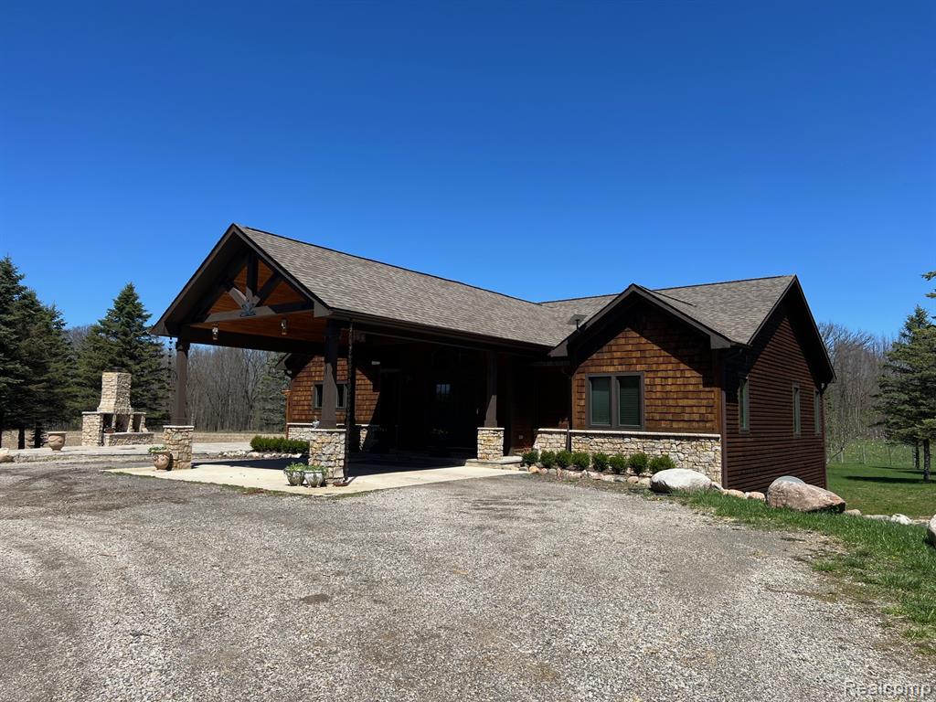 82 Acres of pure serenity! This home is located towards the back of the property giving it total seclusion from the world. She was built in 2019 and finished in 2020 it is a true master price inside. Solid Cherry flooring throughout the main floor, towing ceilings and lined with windows bringing the outdoors inside. Large chefs kitchen with a 7 burner gas range with double ovens, full upright Refrigerator along with a 2 draw cabinet prep cook refrigerator. Built in Microwave and Coffee Maker all lined with top of the line custom cabinets. The primary suite is amazing check out that copper soaking tub along with the walk-in steam shower, just waiting for you to melt away your stressful day! The lower level fully finished walkout basement with heated floors, has a full copper wet bar with all the amenities one would expect. 2 more bedrooms another full bathroom, a 2nd laundry room, living room & rec room with pool table & wood stove to gather around. The outdoor entertainment veranda is plumbed for a full kitchen just needs cabinets and countertops, the wood fireplace will help take the chill off. There also is a greenhouse, 30x40 Pole Barn / garage for your equipment insulated & heated, even a she shed or man cave that is also in heated and air conditioned.  I think you will find it a 'retreat from the everyday grind'.