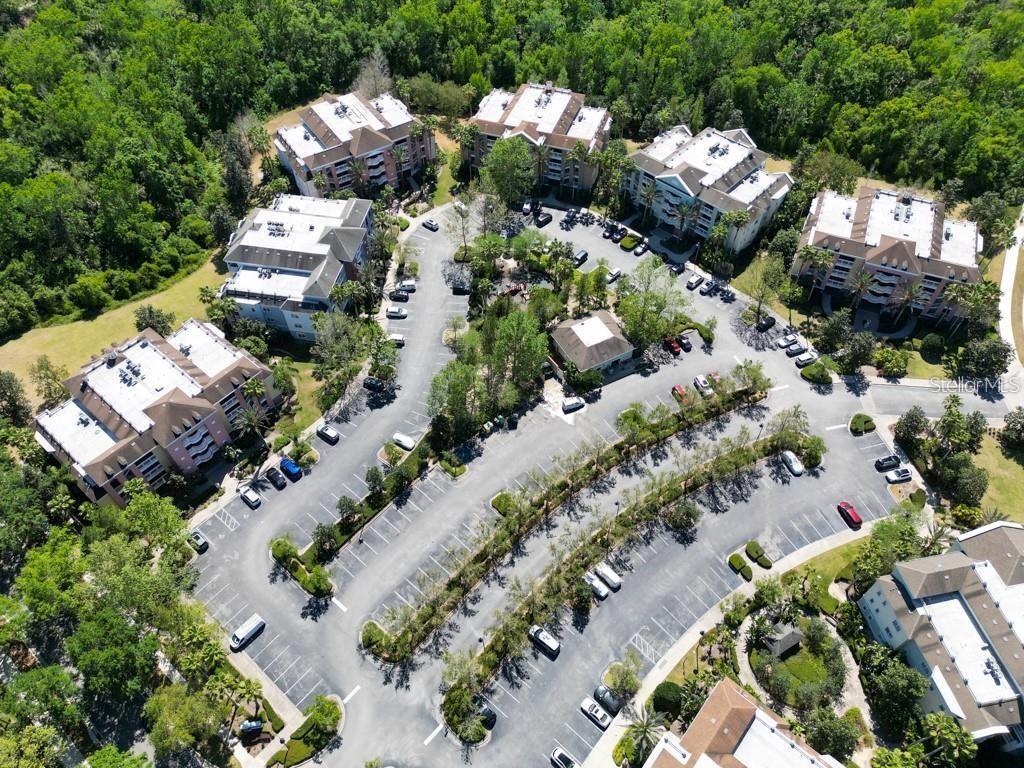 One or more photo(s) has been virtually staged. Welcome to 7658 Whisper Way, Unit 202, a stunning NEWLY 2024 RENOVATED Condo nestled within the heart of the exclusive Guard Gated golf resort community, Reunion Resort. This masterfully designed unit blends modern sophistication with coastal charm, offering a serene retreat after a day at the theme parks or an evening out at local restaurants.

This spacious 1,630 square foot condo features three bedrooms and three bathrooms, providing ample space for relaxation and entertainment. The open-concept kitchen is a chef's dream, boasting newly installed stone countertops, sleek white modern cabinets, and a beautifully crafted tile backsplash. Stainless steel built-in appliances complete the kitchen, making it a perfect gathering spot for friends and family.

Step into the living area and enjoy the newly installed luxury vinyl plank flooring throughout, creating a clean and sharp look. Freshly painted walls and newly installed 2024 bathroom vanities and lighting fixtures enhance the modern aesthetic, catering to today's discerning buyer.

The private balcony offers tranquil conservation views, an ideal setting for unwinding and enjoying the peaceful surroundings. This pet-friendly, partially furnished unit also includes an oversized private outdoor space, ensuring comfort and convenience.

As a resident, you'll have access to many places such as the community pools, a tennis center, and three signature golf courses. The resort's restaurant areas, playground, and organized activities provide endless entertainment options.

Located just six miles from Disney World, this condo is perfect as a full-time residence or a vacation rental.

Experience the luxury and tranquility of Reunion Resort living at 7658 Whisper Way, Unit 202. Your dream condo awaits!