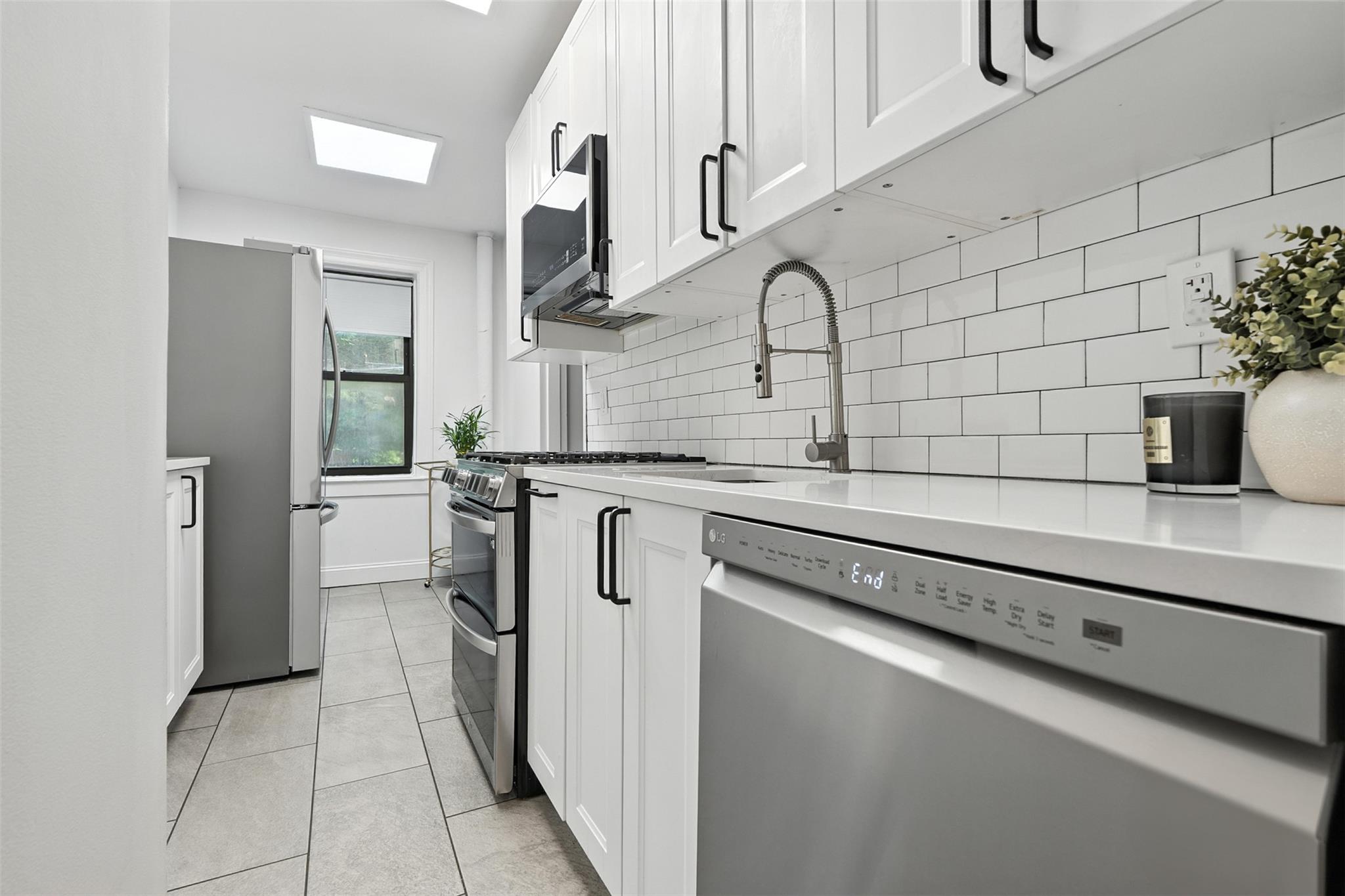 Experience the perfect fusion of timeless elegance and modern convenience in this exquisite 1-bedroom corner unit at 68 E Hartsdale Ave, Unit #1K, nestled within the highly desirable, pet-friendly Country Club Apartments. Just a swift 30-minute commute to Grand Central, this sun-filled pre-war gem offers sophisticated urban living with suburban tranquility. Spanning a generous 800 sq ft, the thoughtfully designed layout welcomes you with classic hardwood floors, subtle recessed lighting, and an oversized living room featuring the rare warmth of a wood-burning fireplace. A welcoming foyer leads seamlessly into the newly renovated kitchen, boasting sleek stainless steel appliances, while the spacious bedroom provides ample comfort with a walk-in closet and an adjacent full bath. Despite being a first-floor unit, offering effortless, stair-free access, its windows are pleasantly elevated, ensuring privacy and a lovely outlook. Residents of this esteemed building benefit from an impressive array of amenities, including a well-equipped fitness center, secure bike room, private storage, convenient card-operated laundry, a garbage chute on every floor, a dedicated live-in super, and a recently updated roof. Beyond the comforts of your home, an unparalleled lifestyle awaits just outside your door; enjoy a short, picturesque stroll to the Hartsdale Metro-North station, and find yourself mere steps from a vibrant selection of local shops, diverse dining options, and scenic nature paths. Directly across the street, the beautifully redesigned Bob Gold Parklet offers a tranquil oasis perfect for relaxation or a breath of fresh air. This is not just an apartment; it’s refined, effortless living perfectly positioned in the heart of Hartsdale, where every convenience is truly at your fingertips.