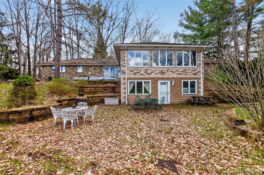 Private country retreat on 20 acres! This ranch-style home sits tucked back off the road and offers 3 bedrooms with potential for a 4th bedroom, 3.5 bathrooms, and scenic views throughout. Inside, you’ll find comfortable living spaces, a distinctive lower-level bar area, and sun-filled rooms overlooking the pond and wooded acreage. Outside, the property is loaded with extras including two pole barns, additional outbuildings, and a solar panel system. Whether you’re looking for privacy, storage, hobby space, or a one-of-a-kind setting, this property has it all.