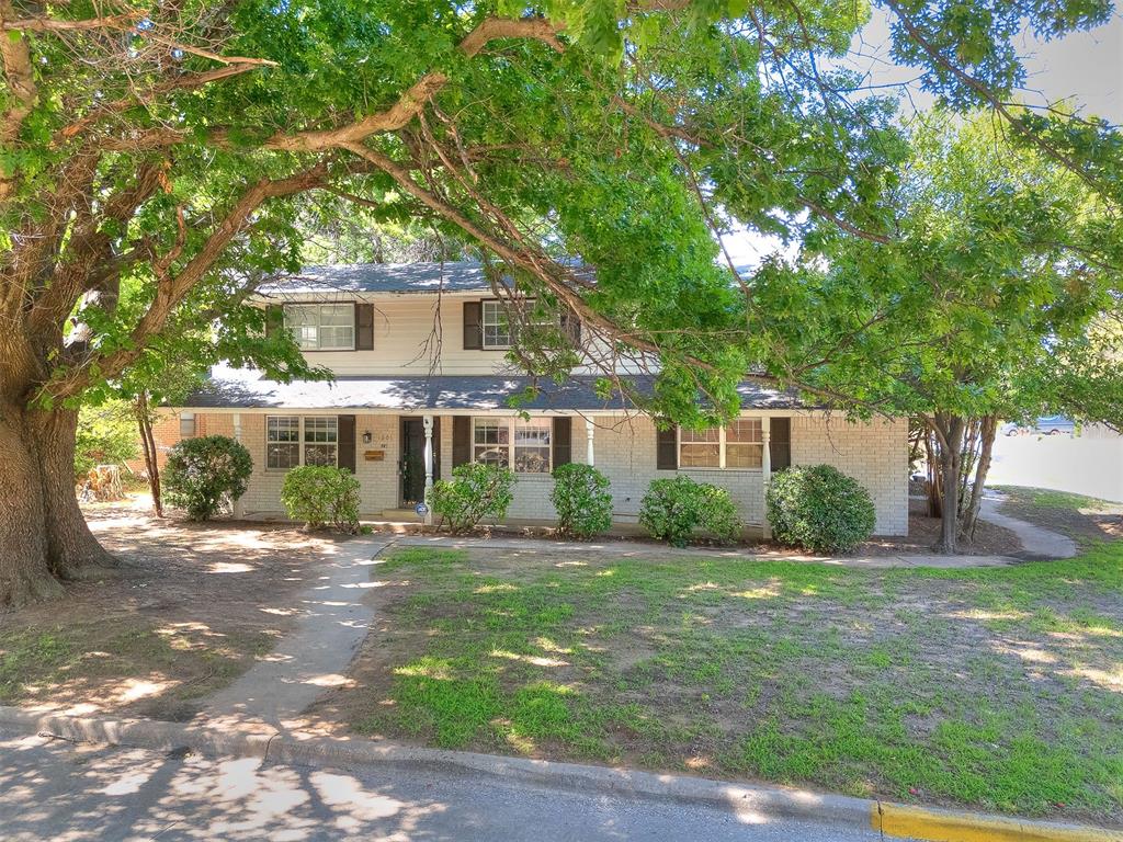 Welcome to this spacious & inviting home in the heart of Norman! Situated on a generous quarter-acre lot, this property offers the perfect blend of space, character, & convenience with Monroe Elementary right across the street! This home features 3 Beds, 2 Baths, 2 Car Garage with a Study/flex room, Den, guest space (no closet downstairs with a Fireplace. Built in the mid 1960's the home offers solid construction & timeless charm with large mature trees in the Hilltop Subdivision. The home has a functional layout with multiple living areas ideal for everyday living & entertaining. The kitchen flows easily into the main living space. The oversized backyard is perfect for outdoor living. Two Fireplaces are in the home: one in the Study/Flex Room, Den room & one in the Master Bedroom. Updates include: Remodeled Kitchen, New Appliances, Quartz Countertops, Backsplash, Lights, Paint, Flooring, New Exterior Paint, New Metal Garage Doors, New wood Flooring, Lights, Hardware throughout on the First Floor. New Carpet, Paint, Lights, Hardware, New Glass & Tile Shower are Upstairs. Bedrooms are all Upstairs. Fence was replaced 5 years ago. This home is perfect for a residence or as a rental for college students.