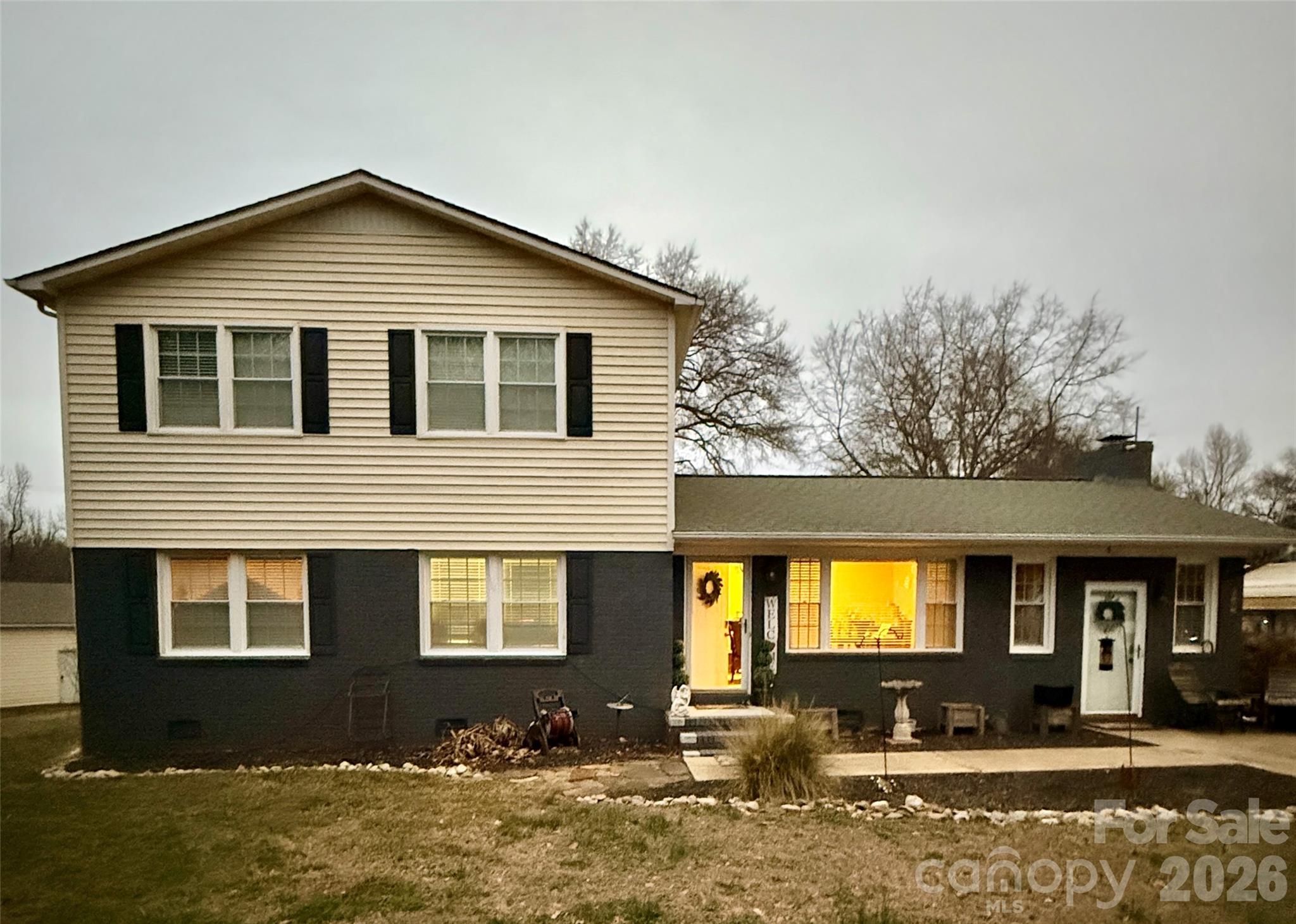 Rare find in Rock Hill—over 2 acres, a massive powered workshop, and walkable access to Lake Wylie.Imagine being able to walk or take a quick golf cart ride to the lake whenever you want—morning coffee by the water, sunset walks, or spontaneous afternoons at Ebenezer Park or Lake Club Marina. This is the kind of everyday lifestyle that makes this property truly special—and incredibly hard to find.Set on a beautifully positioned corner lot with a mature magnolia tree, this fully renovated home offers the space, flexibility, and functionality buyers are searching for—without giving up convenience.Inside, you’ll find a bright and inviting layout with 2,600+ square feet, featuring a spacious family room, abundant natural light, and a stunning picture window overlooking the property. A cozy wood-burning fireplace (with rebuilt firebox in 2025) anchors the main living space, while the keeping room with its own entrance provides a flexible retreat for relaxing, working, or hosting guests. The layout is both functional and versatile, with three bedrooms on the main level and a private, oversized primary suite upstairs, creating a true retreat with space and separation.Step outside and the property truly opens up—over 2 acres with a fully fenced 1-acre field plus additional enclosed yard areas , offering endless possibilities for recreation, pets, storage, or simply enjoying the outdoors.For those needing space to work, build, or store, the 1,200+ sq ft detached garage/workshop is a standout feature—complete with power, pneumatic air lines, and compressor, ready for serious projects or hobby use . A 3-car carport adds even more flexibility.Recent updates include:New roof on detached garage/workshop (2025)Rebuilt fireplace firebox (2025)New HVAC system for second level (2024)Expanded and fenced outdoor spaces (2024)Conveniently located between Rock Hill and Lake Wylie with easy access to I-77 and a short drive to Charlotte, this property offers the rare combination of space, functionality, and location—with no HOA restrictions .If you've been looking you know it doesn't come along often - combining land, storage, lake access, and everyday livability in a unique homestead property!