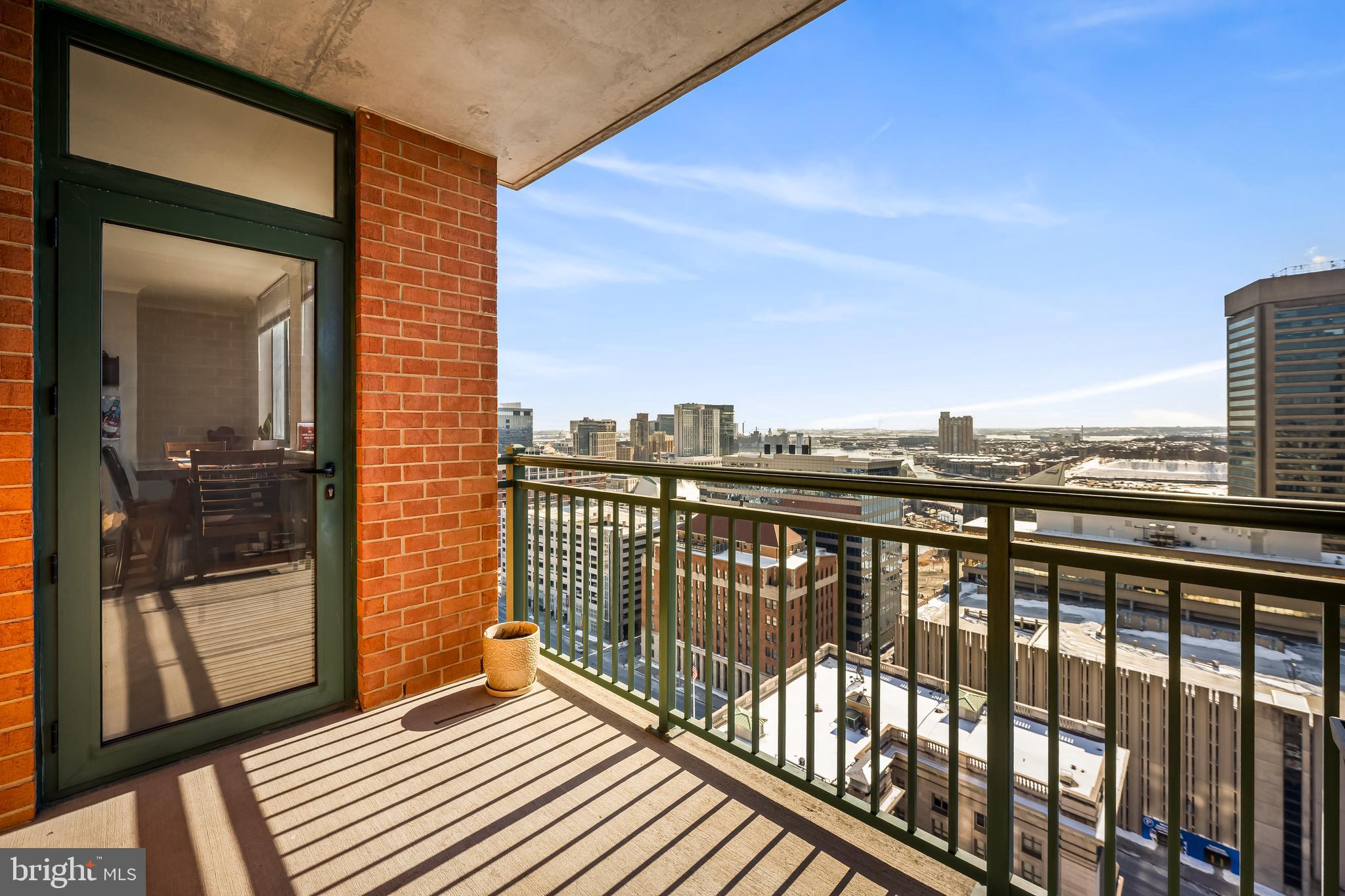 Welcome to 414 Water Street #2202 — a premier high-floor residence offering some of the best panoramic water and city views in the entire building. This 2-bedroom, 2 full bath condo delivers the ideal blend of skyline energy and Inner Harbor serenity, with expansive windows that flood the space with natural light and frame truly standout views. The thoughtfully designed layout features bedrooms on opposite sides for privacy, an open-concept living and dining area, and a well-appointed kitchen with granite countertops, island seating, and gas cooking. Hardwood flooring, refined finishes, and tasteful upgrades carry throughout, while the spacious primary suite offers a walk-in closet and en-suite bath. Step onto your private balcony to take in sweeping harbor and city vistas—day or night. Located in the full-service 414 Water Street building with 24-hour concierge, rooftop pool, fitness center, and secure parking, all just steps from Harbor East, downtown dining, and the waterfront. A rare opportunity to own one of the building’s most compelling view-oriented units.