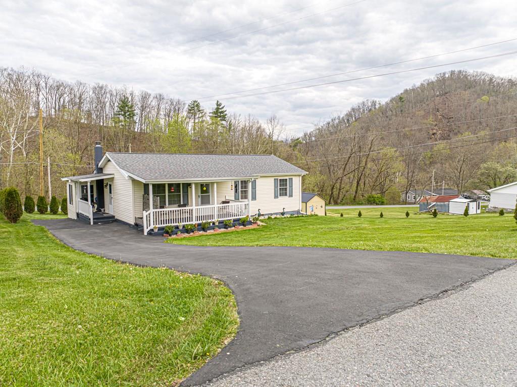 Welcome to 18160 Ridgeview Drive—an inviting, beautifully updated single-level ranch that's move-in ready and nestled in the heart of Southwest Virginia's outdoor paradise. With a shady front porch for rocking, this home is Just minutes from the world-renowned Virginia Creeper Trail, the scenic Jefferson National Forest, and the Holston River (Middle and South Forks). It offers a perfect blend of comfort, convenience, and adventure. Historic Abingdon—with its charming shops, restaurants, and cultural attractions—is just a short drive away.  Inside, you'll find a thoughtfully updated 3-bedroom layout with additional flexible living spaces, including 2 bright sunrooms with "haint blue" ceilings, one serving as a dedicated office and the other as a room for guests and hobbies.  This home has been extensively improved, offering peace of mind and modern appeal. Recent updates include a beautifully renovated tiled bathroom, new kitchen appliances, new paint, updated flooring, stylish new ceiling fans, and replacement windows and doors. Major system upgrades such as a new roof, heat pump, vinyl siding, and added insulation enhance both efficiency and durability. All pipes have been insulated.  Outside, the property continues to impress with two attractive storage sheds (one with a second driveway), new shutters, and thoughtfully designed evergreen screen plantings that provide privacy and year-round curb appeal.   Whether you're seeking a full-time residence, a low-maintenance retreat, or a basecamp for hiking, biking, fishing, and exploring all that the region has to offer, this move-in-ready home delivers exceptional value in an unbeatable location.