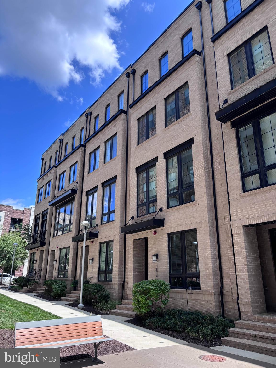 **Professional photos and floor plan will be uploaded on August 26.  Open House schedule will be posted, shortly. VA Assumable Loan at 2.25% for qualified Veterans, only.**Experience unparalleled craftsmanship inside this intimate collection of contemporary townhomes perfectly positioned just 1.5 blocks from the Silver Line Metro and the vibrant energy of Reston Station! This sophisticated residence offers 3100+ finished square feet across four beautifully appointed levels with an extraordinary attention to detail at every turn.From the moment you enter, the quality is unmistakable. This meticulously crafted modern residence offers an open concept floor plan including 10ft ceilings, wide plank hardwood floors, and exquisite architectural details throughout.  The main level is the heart of this home. The gourmet kitchen includes premium shaker style wood cabinetry with dovetail and soft close construction, convenient roll out drawers, 5 burner gas cooktop, and an oversized prep island. The kitchen flows seamlessly into the dining and living spaces. The dining area is elevated by custom built-in cabinetry, quartzite countertops, tile backsplash, and a wine refrigerator, while the sun-drenched living room provides the perfect backdrop for relaxed gatherings or sophisticated entertaining.  Retreat to the luxurious primary suite complete with two spacious walk in closets and spa-inspired bath with dual sinks and oversized frameless glass shower. A secondary ensuite bedroom on this level provides comfort and flexibility. The 4th level loft is a destination of its own, offering a private bedroom, full bath, and versatile recreation space.  Outdoor living is elevated with a captivating ROOFTOP terrace showcasing cozy fireplace and custom Maanta shade sails.  The entry level provides even more flexibility with an additional bedroom - ideal for study, fitness, and/or guest quarters.  The garage is thoughtfully upgraded with epoxy floors, workbench, shelves, and overhead storage.EXTRA EXTRA EXTRA ... This home boasts $100,000 in post builder upgrades including horizontal hand rails, designer lighting, custom blinds, window treatments, ceiling fans, UV window films, custom closet organizers, designer wallpaper, and more!LOCATION LOCATiON LOCATION ... Unbeatable.  Just moments from Reston Station's dining and entertainment - live music, outdoor movies, Vida Fitness, Starbucks, the W&OD Trail, and Silver Line Metro. Convenient access to Dulles International Airport and Ronald Reagan National Airport.  And, effortless commutes to all major business districts including Washington DC and Tysons Corner.  This is Reston's most connected and exciting destinations!