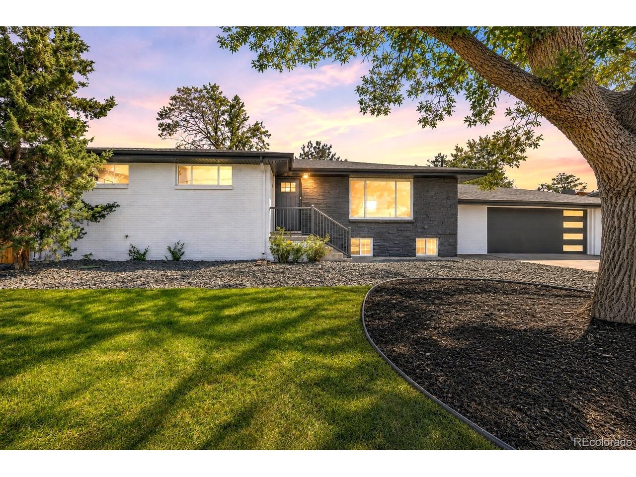 Looking for your modern dream home with room for everyone and everything? Welcome to 6080 Holly Street.With 7 bedrooms, 2 bathrooms, and a huge .28-acre lot, this home offers the kind of space that's getting harder to find. Whether you need extra bedrooms, home offices, or room for guests, there are plenty of options here.The work has already been done with new interior and exterior paint, new laminate flooring and carpet, restained hardwood floors, LED lighting, and bathrooms with beautiful new tile. The kitchen features a stunning accent tile wall, new soft-close cabinets, quartz countertops, and GE appliances for a clean, modern look.The basement adds even more possibilities with extra bedrooms and a large flex space for a second living room, game room, playroom, or movie room. The oversized laundry room already has a sink, cabinetry, and quartz counters, giving you a head start if you'd like to explore adding a second kitchen area. The downstairs offers great potential for multigenerational living, extended family, or possible rental income.Outside, the .28-acre lot gives you room to enjoy! There's lush grass, new landscaping, mature trees, a patio, and a propane fire pit with a sitting area, perfect for Colorado evenings. You'll also have plenty of parking for multiple vehicles, recreational vehicles, and weekend toys, plus a new modern garage door.You're close to Pioneer Park, DICK'S Sporting Goods Park, Rocky Mountain Arsenal National Wildlife Refuge, trails, recreation, and multiple highways for easy access around the Denver metro area.The sellers are also including a home warranty for the new owner.Seven bedrooms, a huge lot, tons of parking, modern updates, flexible living space, and so many possibilities. Come see 6080 Holly Street for yourself. You don't want to miss this one!