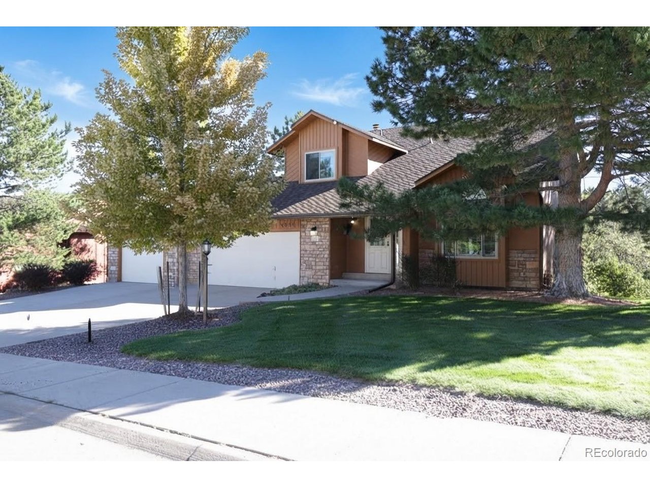 Welcome to The Pinery, where towering ponderosa pines, rolling terrain and a strong sense of place create a setting that feels distinctly Colorado. This charming home sits on nearly half an acre, with a rare sidewalk-lined location and a beautiful backdrop of mature pines. Inside, character and warmth come through in the hardwood floors and comfortable living spaces, while an updated kitchen brings a fresh feel to the heart of the home. The layout has an easy rhythm for everyday life, with plenty of natural connection between the main living areas and the outdoors.The primary suite is generously sized and paired with an updated bathroom, creating a comfortable space to start and end the day. A fireplace adds warmth to the living area, while the walk-out lower level provides additional flexibility for the way you live and work. Outside, the deck is the standout, overlooking the surrounding pines and giving you a natural place to enjoy morning coffee, dinner or a quiet Colorado evening. A three-car garage adds valuable space for vehicles, gear and weekend projects.Life in The Pinery extends well beyond the property line. The community is threaded with trails, including the four-mile Pinery Loop Trail connecting Bingham Lake, Lakeshore Park, Pinery Park and the Cherry Creek Regional Trail. Bingham Lake adds another scenic spot for walking, fishing and picnicking, while Parker's shops, dining, recreation and downtown amenities are just minutes away. It's a home and a setting that make it easy to appreciate what makes The Pinery such a special part of Parker.-This property qualifies for --The Buyer's Choice Incentive contributes 1% of the loan amount to the cost of their choice- permanent rate buy down, temporary buy down, or closing costs.  Ask listing agents about this amazing offer!!